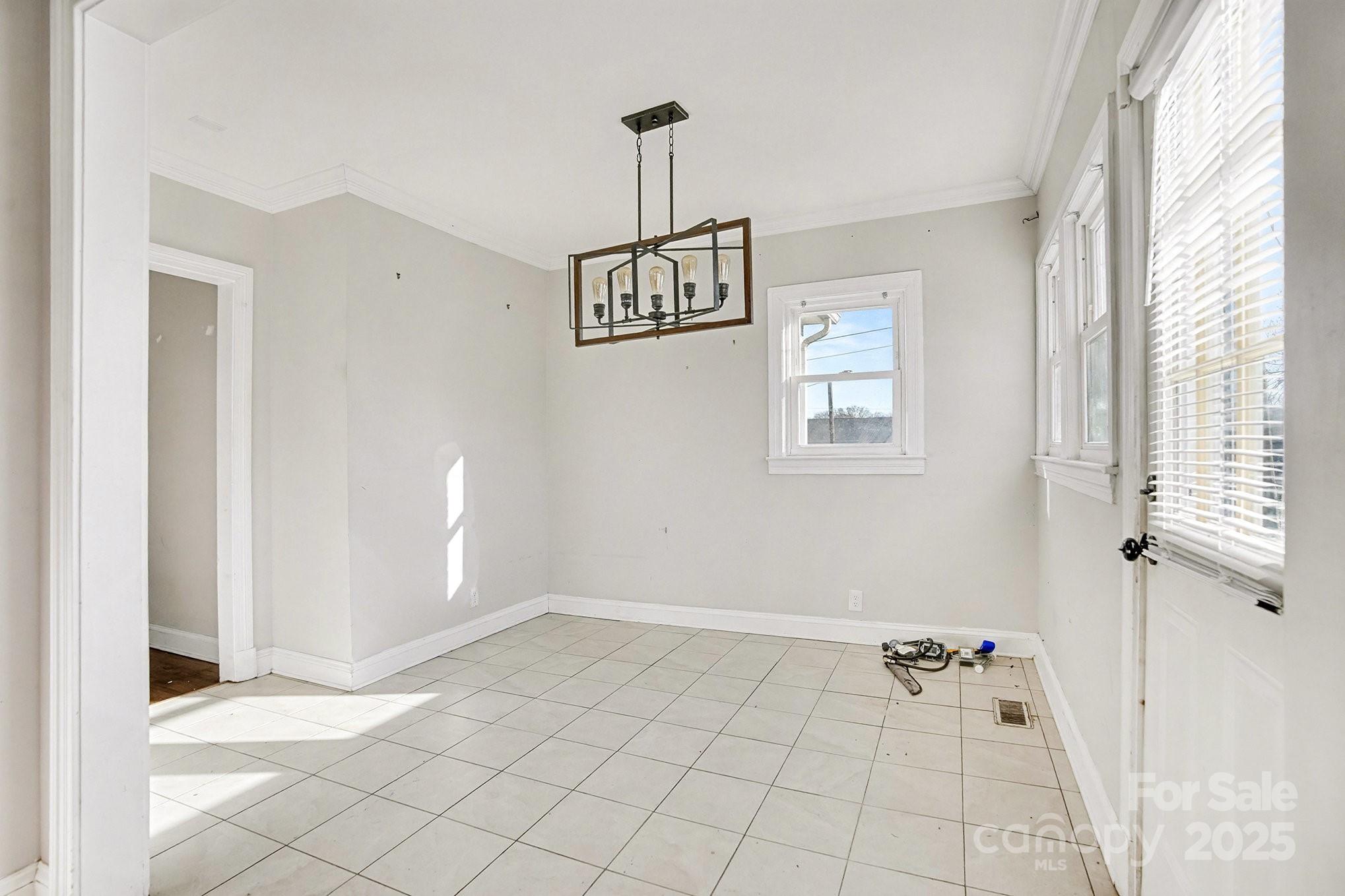 406 South Catawba Street Lancaster, SC 29720 - Photo 18 of 35 a view of a room with wooden floor and windows