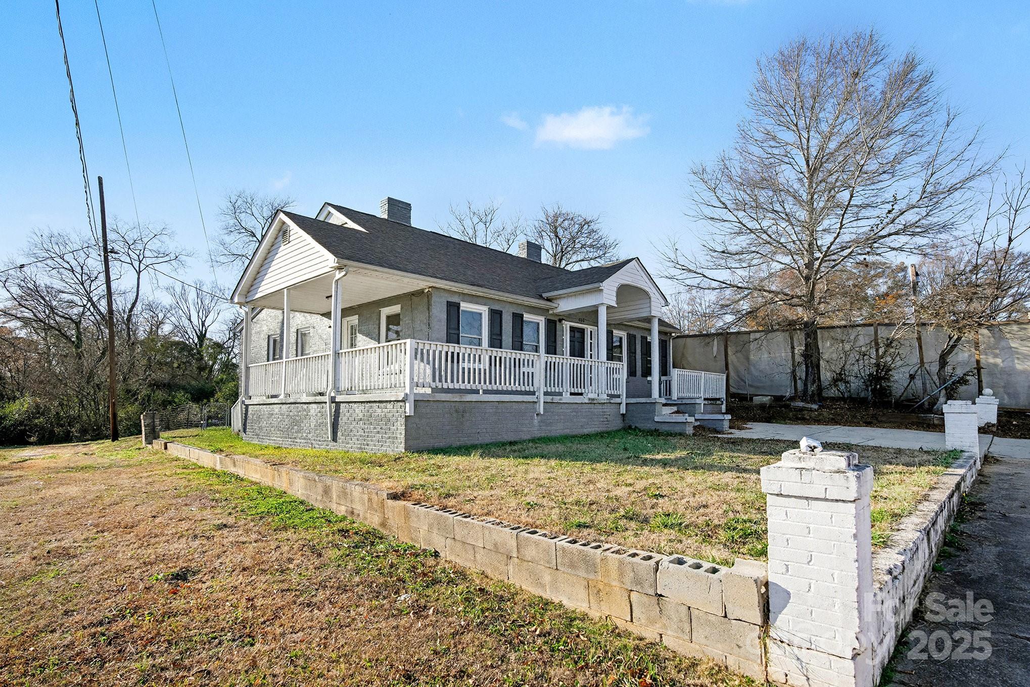 406 South Catawba Street Lancaster, SC 29720 - Photo 2 of 35 a front view of house with yard and trees in the background