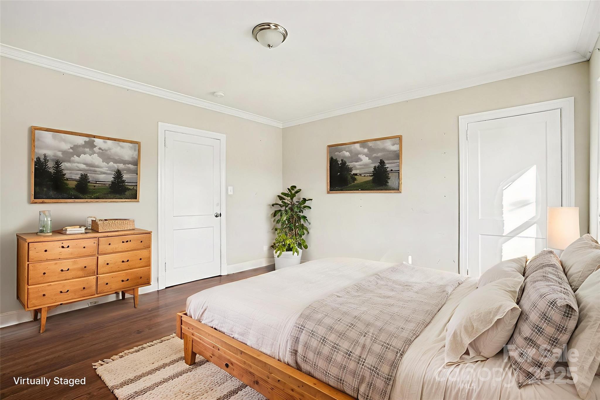 406 South Catawba Street Lancaster, SC 29720 - Photo 24 of 35 a bedroom with a bed and wooden floor