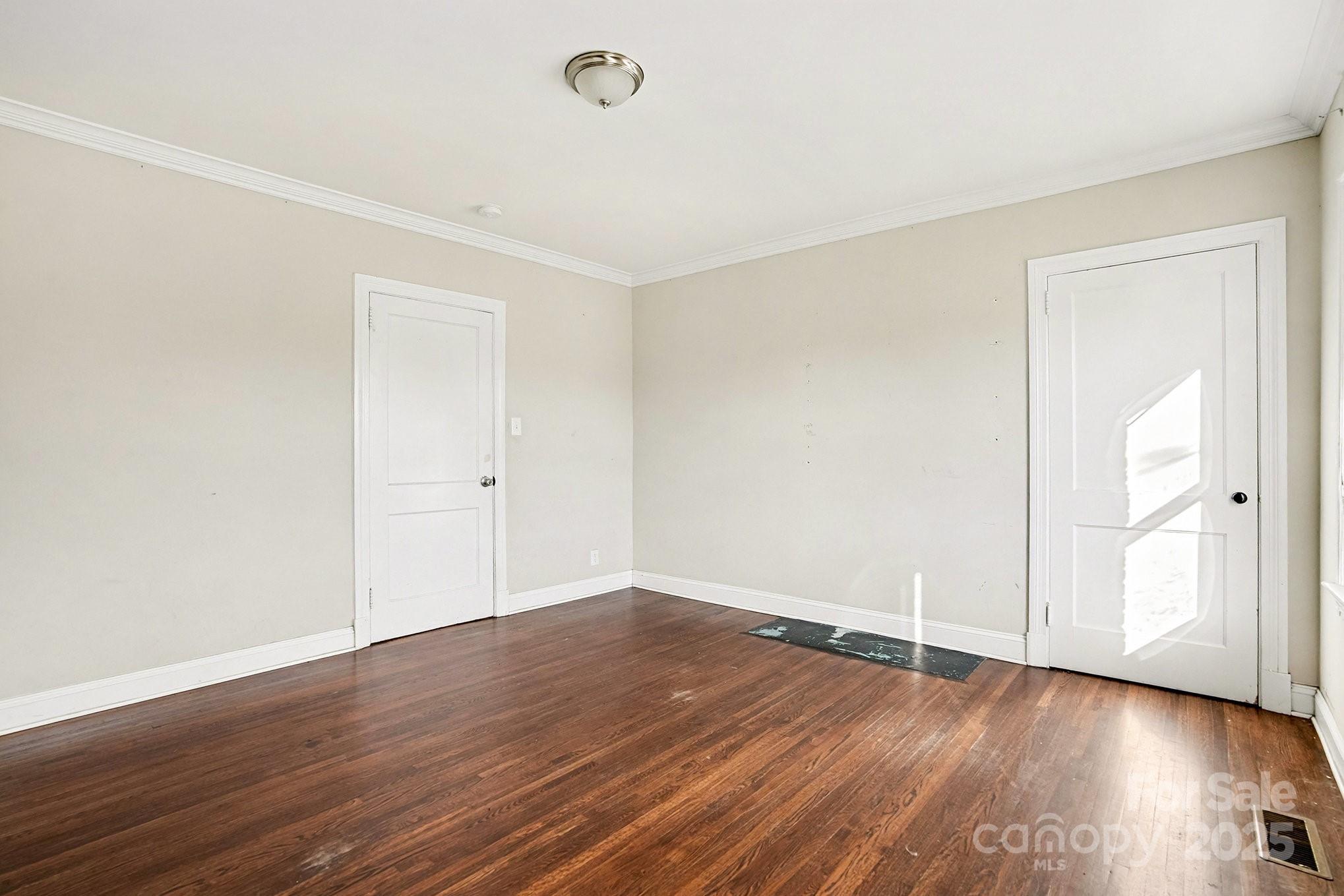406 South Catawba Street Lancaster, SC 29720 - Photo 25 of 35 an empty room with wooden floor