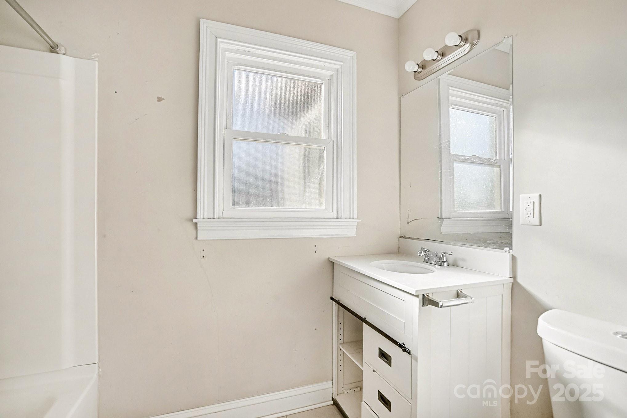 406 South Catawba Street Lancaster, SC 29720 - Photo 26 of 35 a bathroom with a sink and a toilet