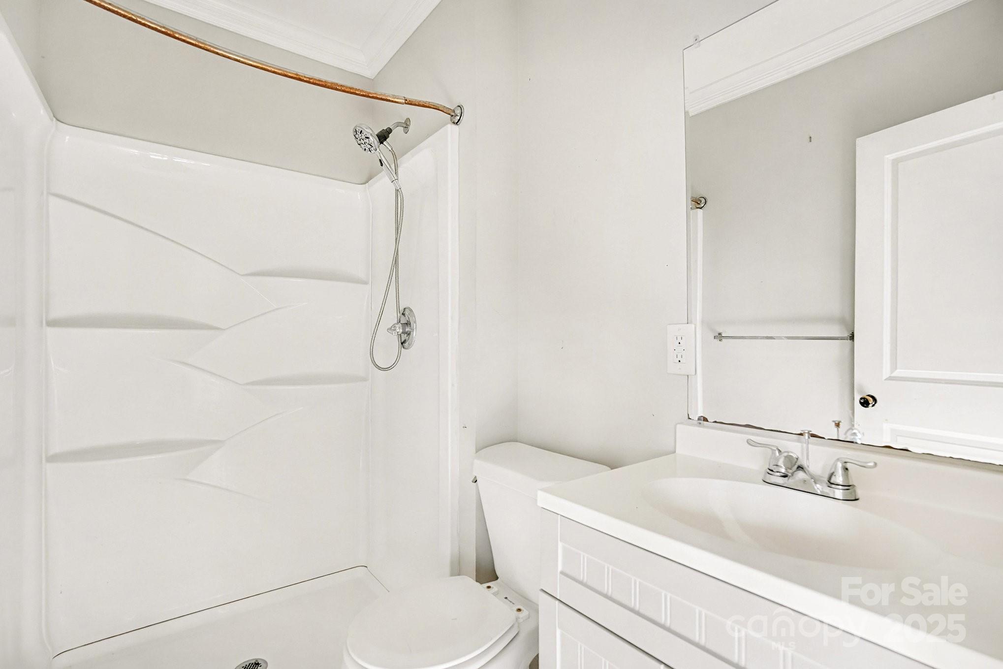 406 South Catawba Street Lancaster, SC 29720 - Photo 27 of 35 a bathroom with a granite countertop sink toilet and shower