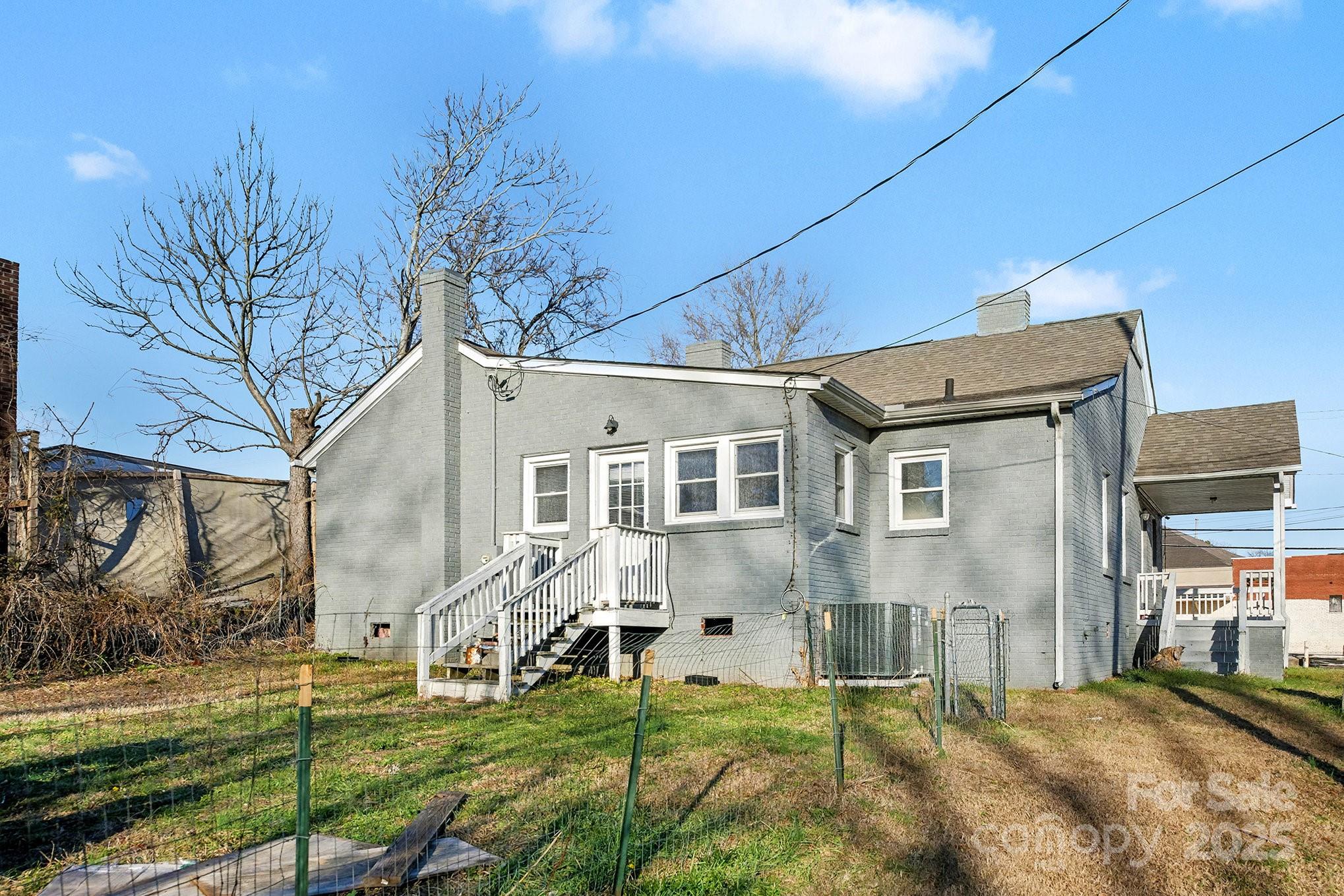 406 South Catawba Street Lancaster, SC 29720 - Photo 35 of 35 a backyard of a house with barbeque oven and outdoor seating