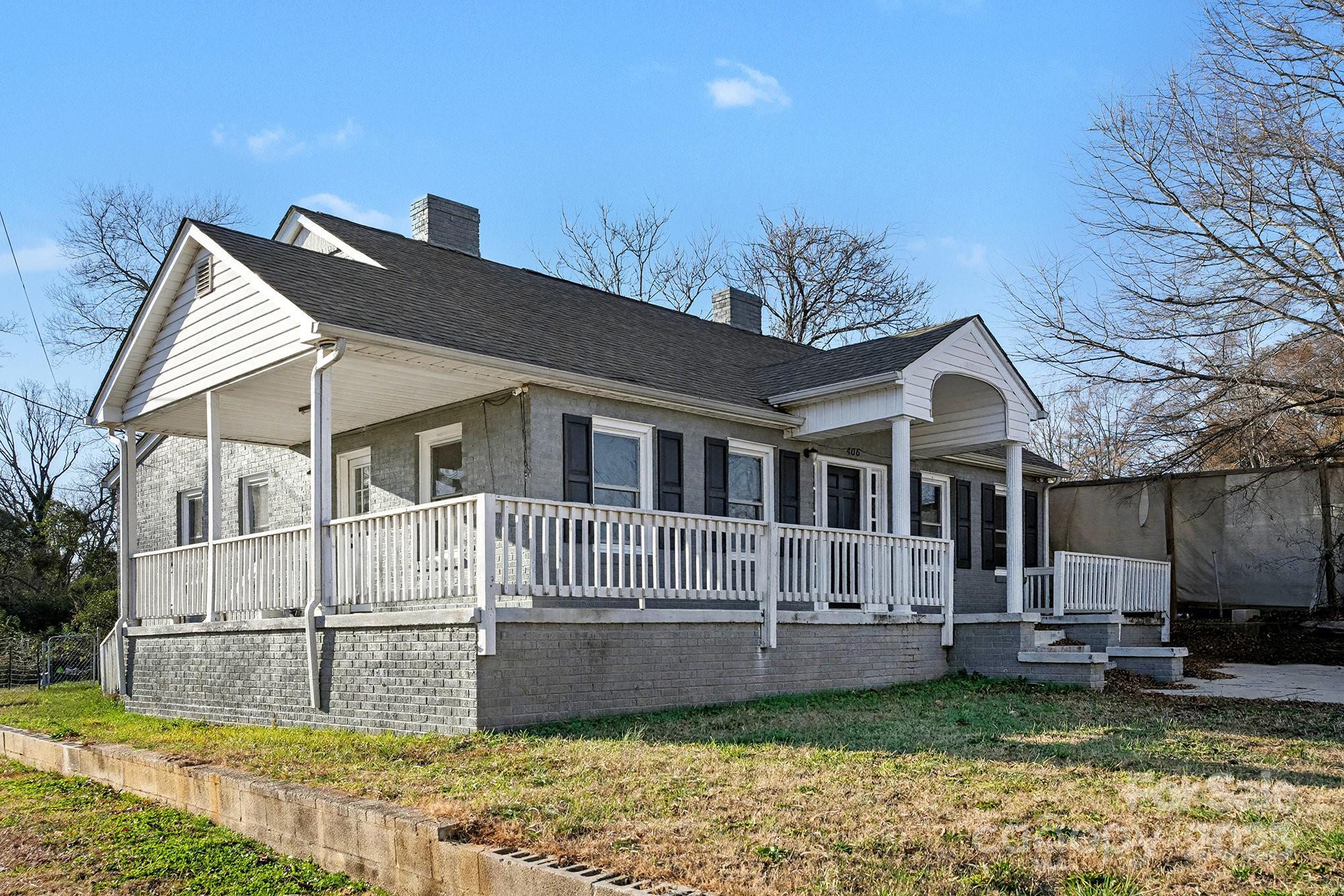 406 South Catawba Street Lancaster, SC 29720 - Photo 4 of 35 a front view of a house with a garden and yard