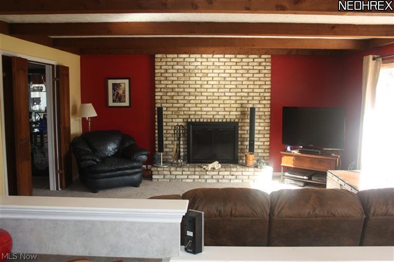 341 Edmore Road Akron, OH 44333 - Photo 4 of 25 Floor to ceiling brick fireplace in Family room. Sliding door to deck.