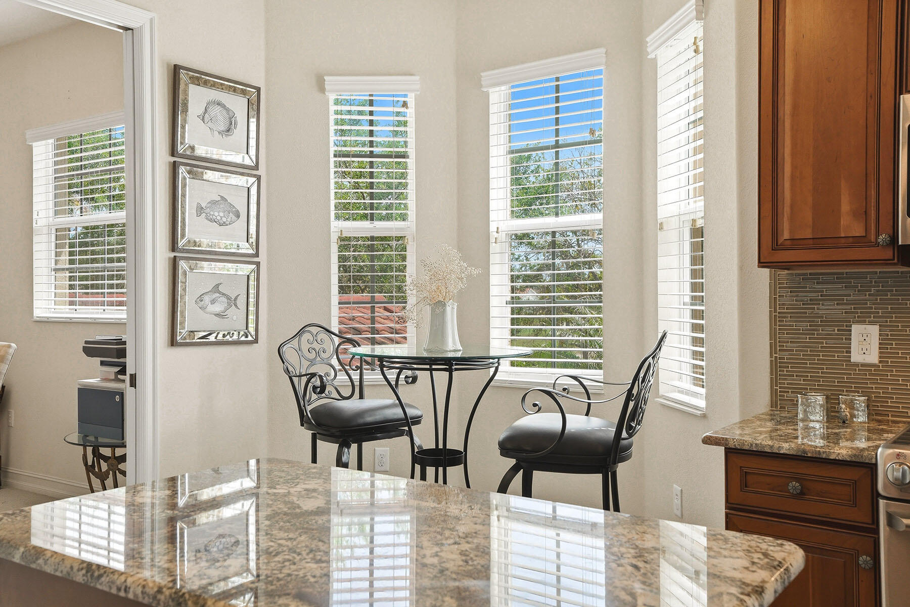 8605 Champions Point, Unit 103 Naples, FL 34113 - Photo 8 of 44 a living room with furniture and floor to ceiling windows