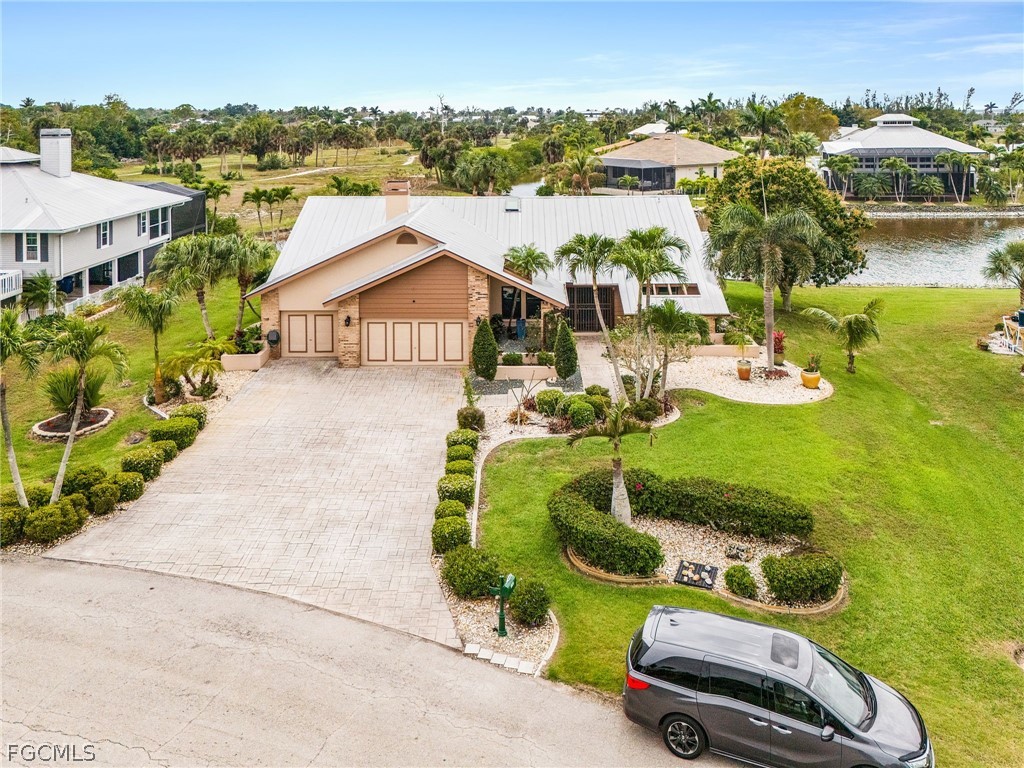 7747 Grande Pine Road Bokeelia, FL 33922 - Photo 40 of 45 an aerial view of a house with yard swimming pool and mountain view
