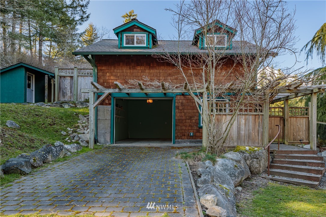 1108 Lopez Sound Road Lopez Island, WA 98261 - Photo 16 of 18 a front view of a house with garden