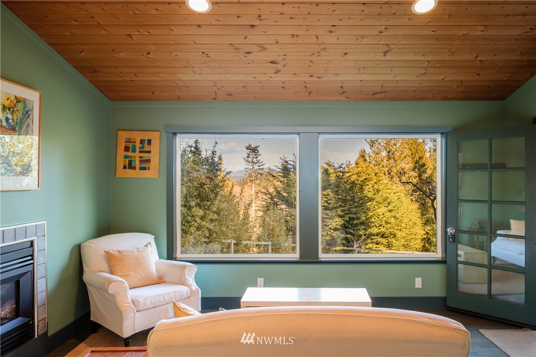 1108 Lopez Sound Road Lopez Island, WA 98261 - Photo 5 of 18 a bedroom with furniture and a window