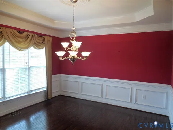 a view of a room with window and chandelier