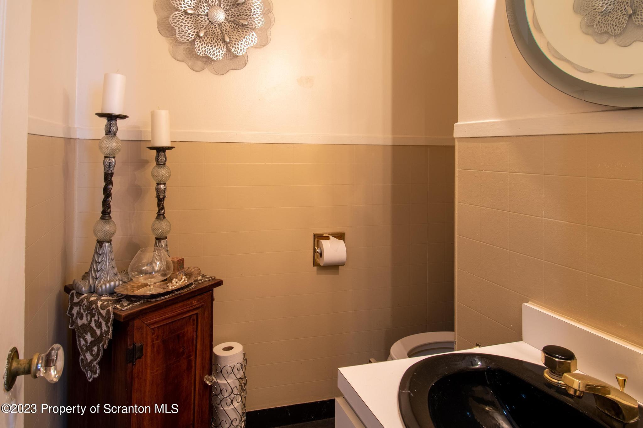 835 North Webster Avenue Scranton, PA 18510 - Photo 12 of 43 a bathroom with a sink a toilet and mirror