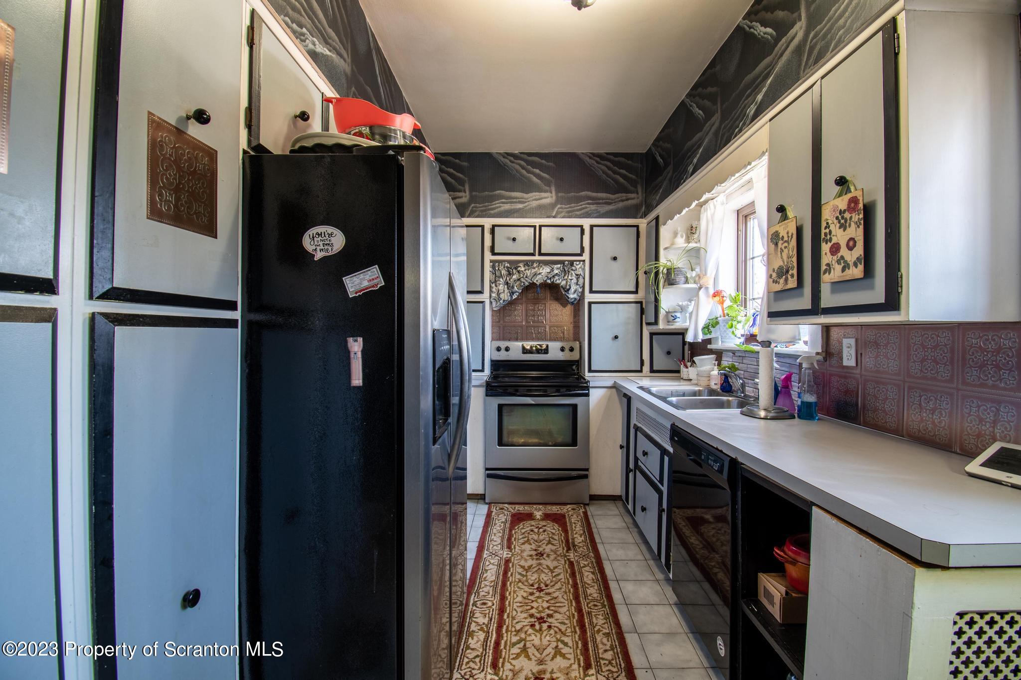 835 North Webster Avenue Scranton, PA 18510 - Photo 17 of 43 a kitchen with stainless steel appliances granite countertop a refrigerator and a stove