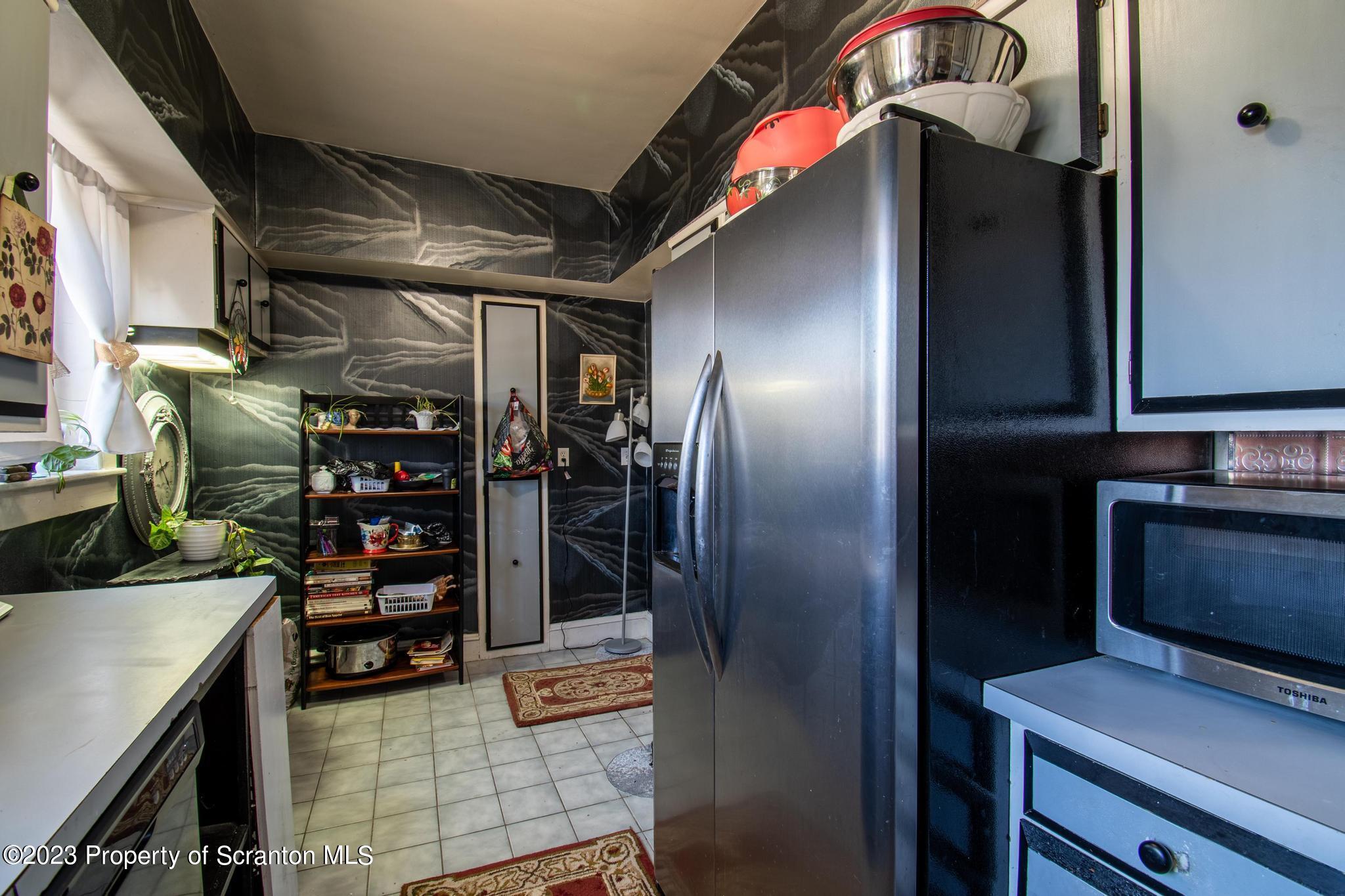 835 North Webster Avenue Scranton, PA 18510 - Photo 19 of 43 a kitchen with refrigerator and table
