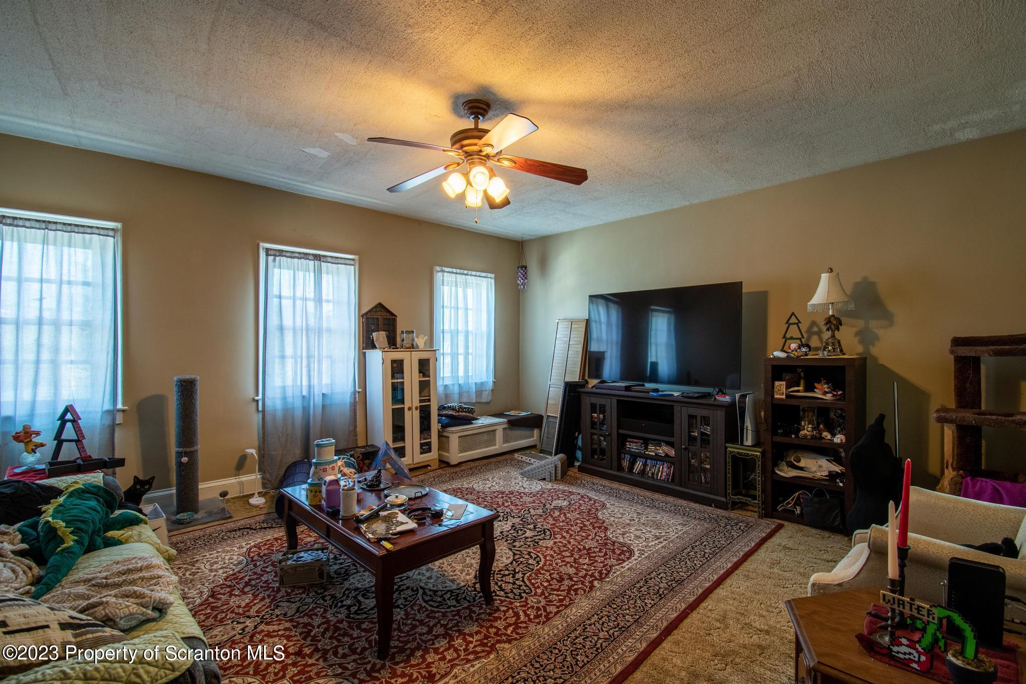 835 North Webster Avenue Scranton, PA 18510 - Photo 20 of 43 a living room with furniture and a flat screen tv