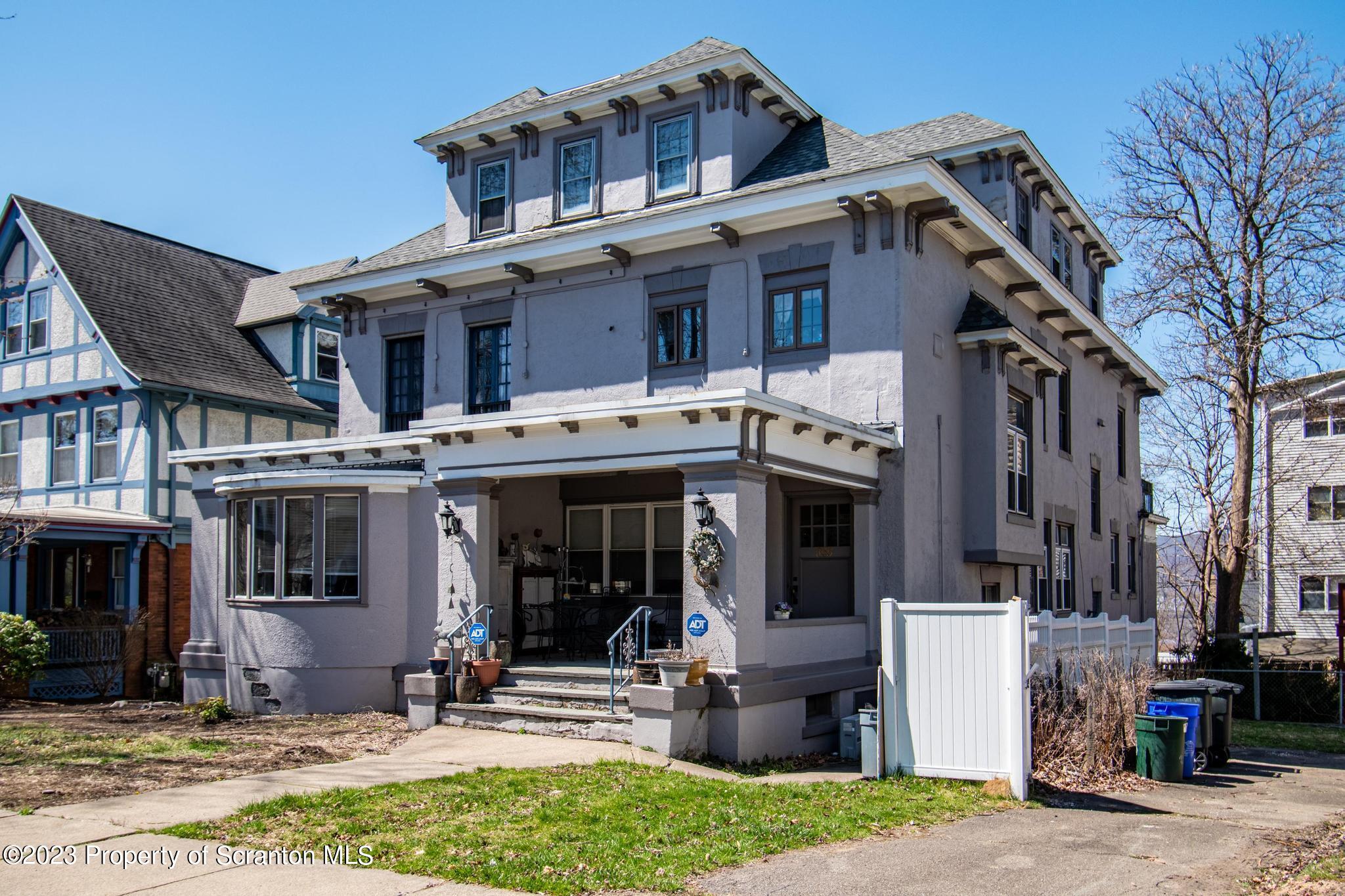 835 North Webster Avenue Scranton, PA 18510 - Photo 2 of 43 a front view of a building with a garden