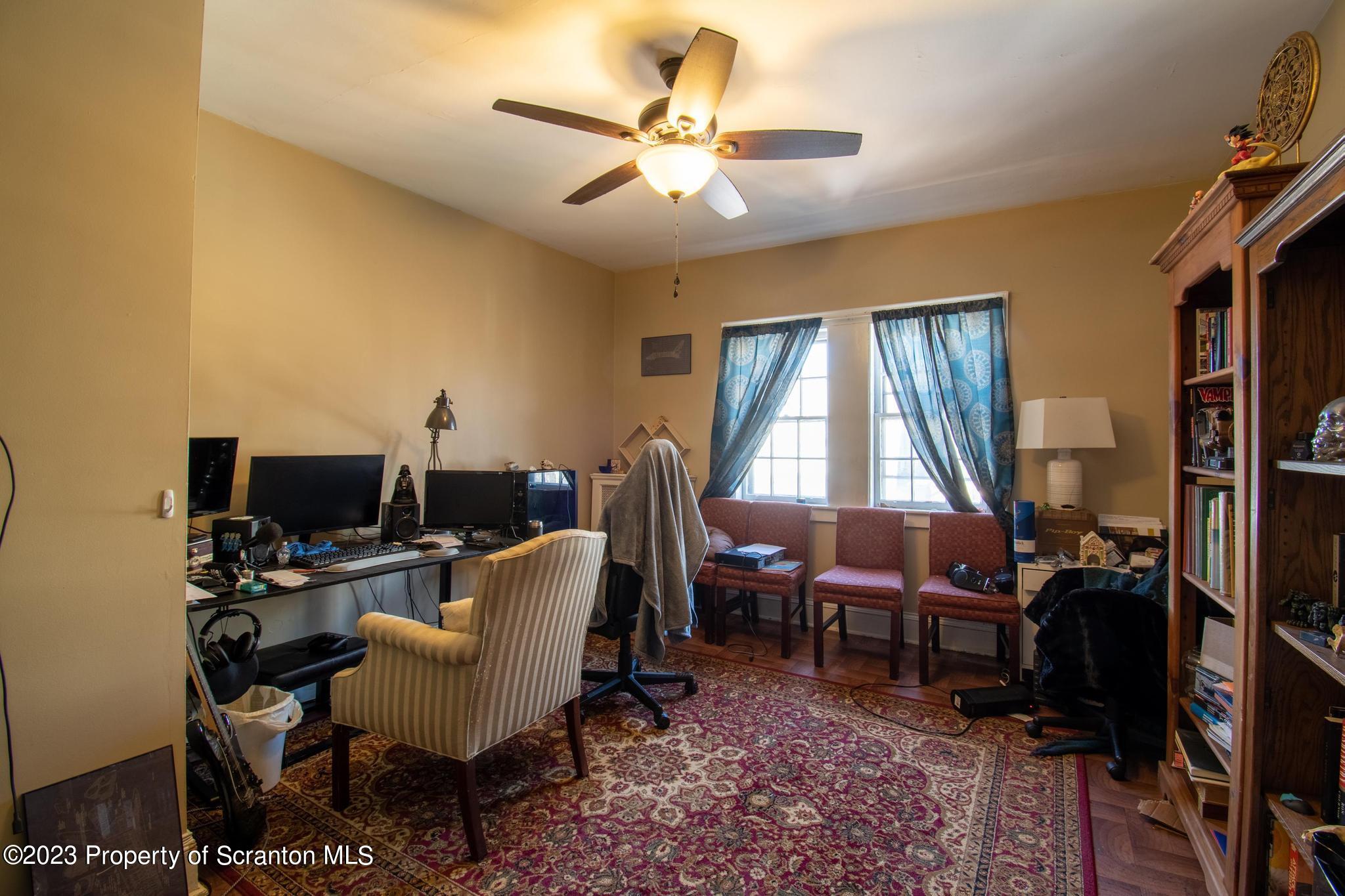 835 North Webster Avenue Scranton, PA 18510 - Photo 27 of 43 a living room with furniture a chandelier and a window