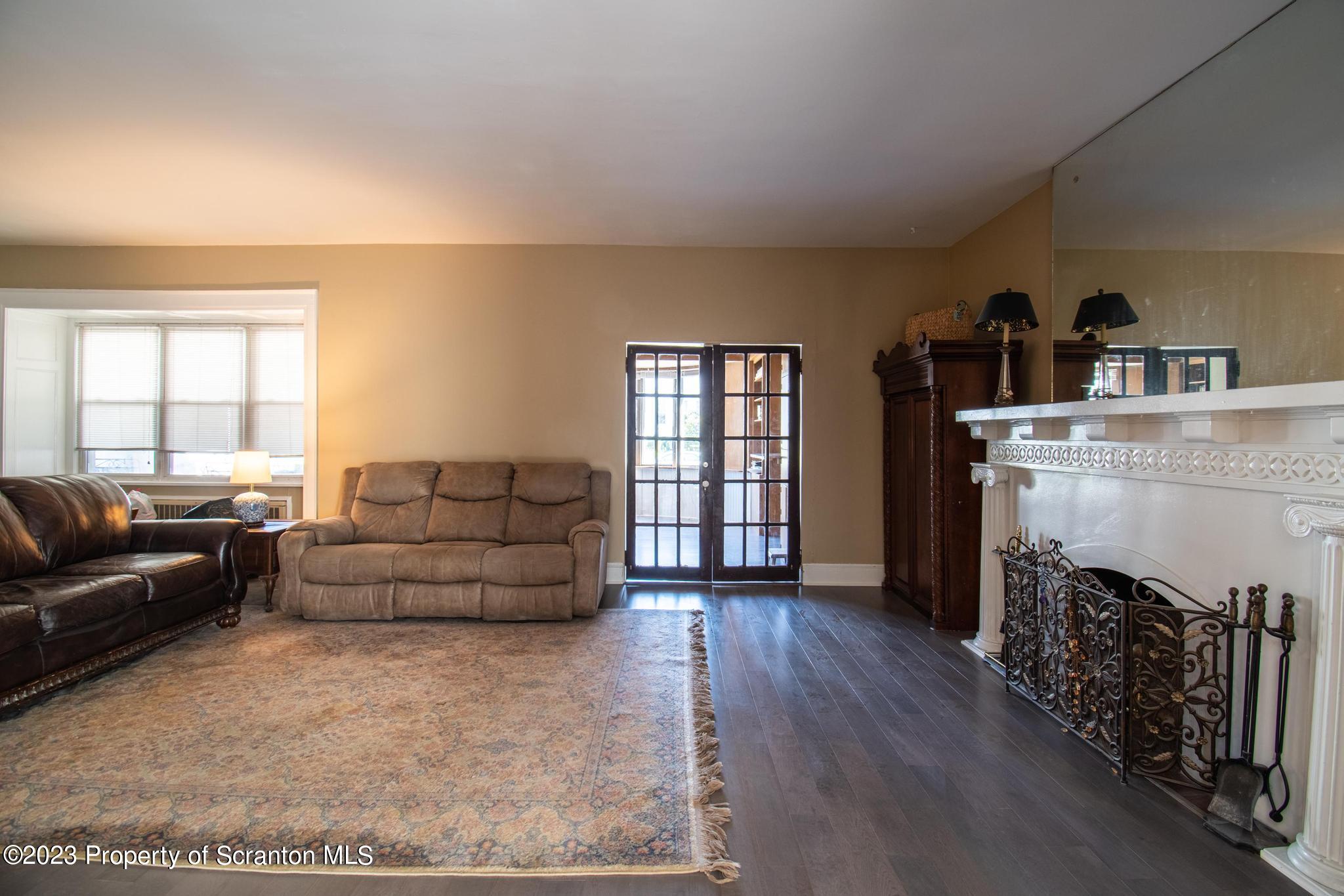 835 North Webster Avenue Scranton, PA 18510 - Photo 29 of 43 a living room with furniture and a fireplace