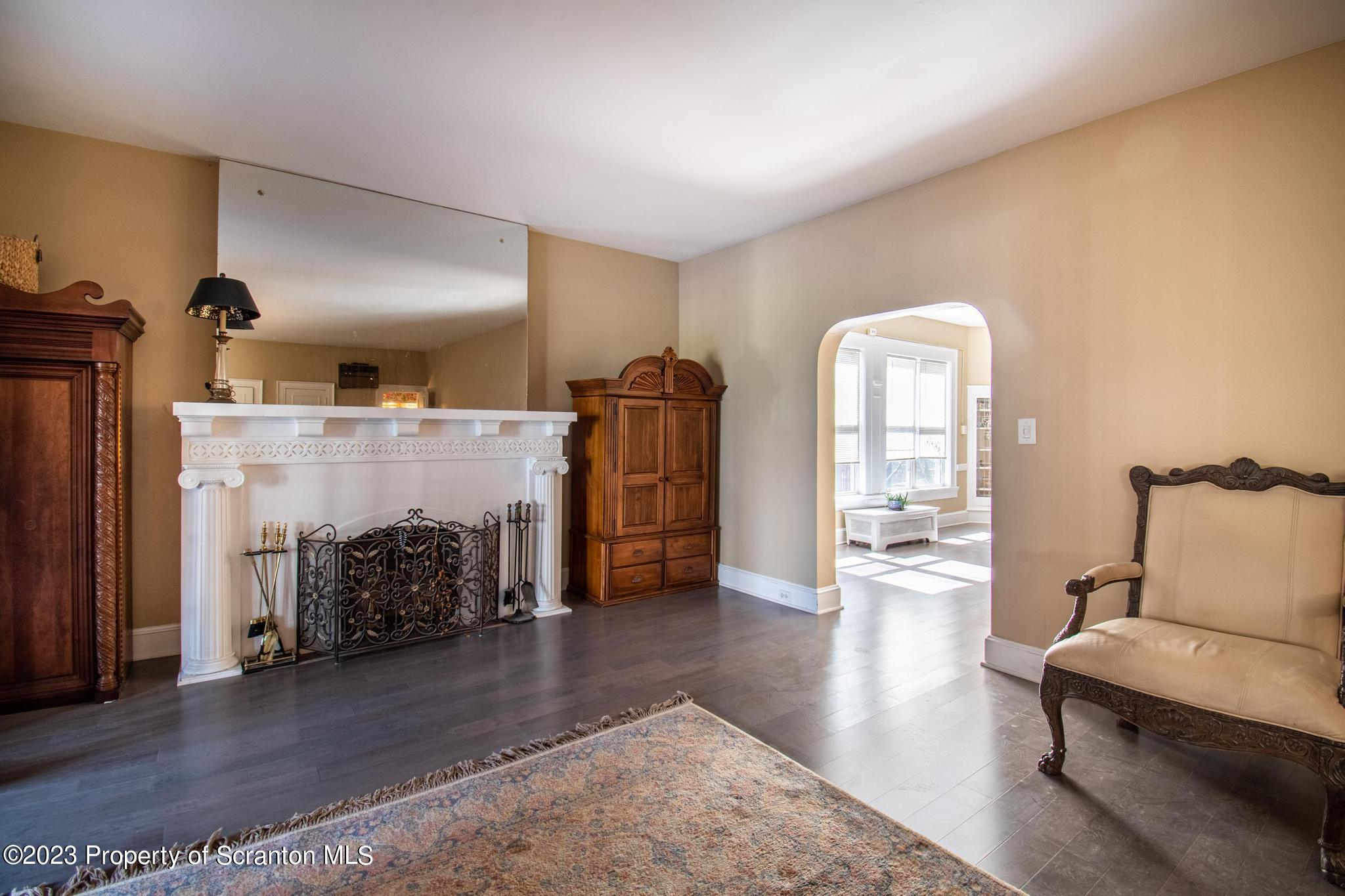 835 North Webster Avenue Scranton, PA 18510 - Photo 32 of 43 a living room with furniture and a fireplace