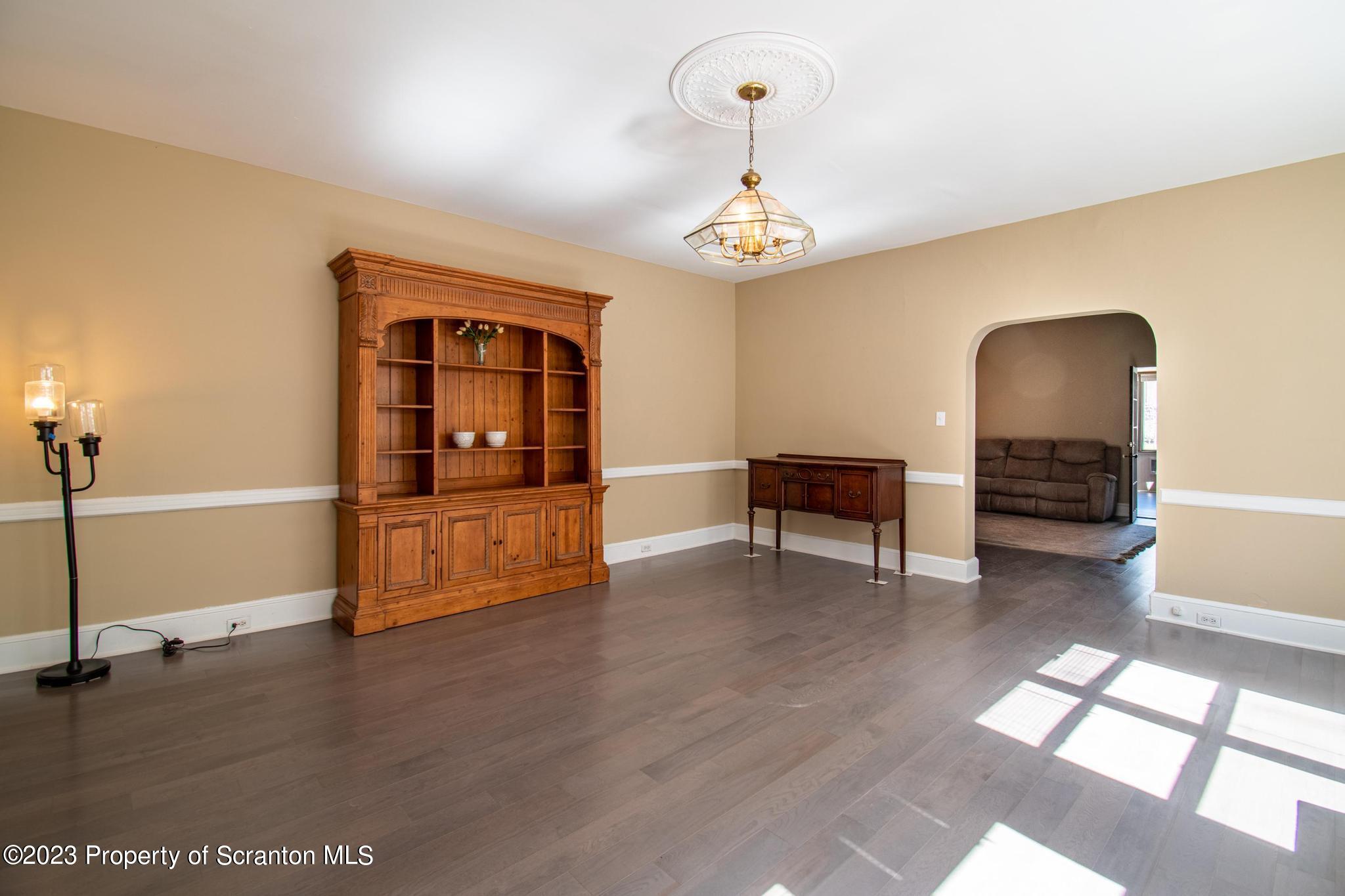 835 North Webster Avenue Scranton, PA 18510 - Photo 34 of 43 a view of a livingroom with furniture wooden floor and ceiling fan