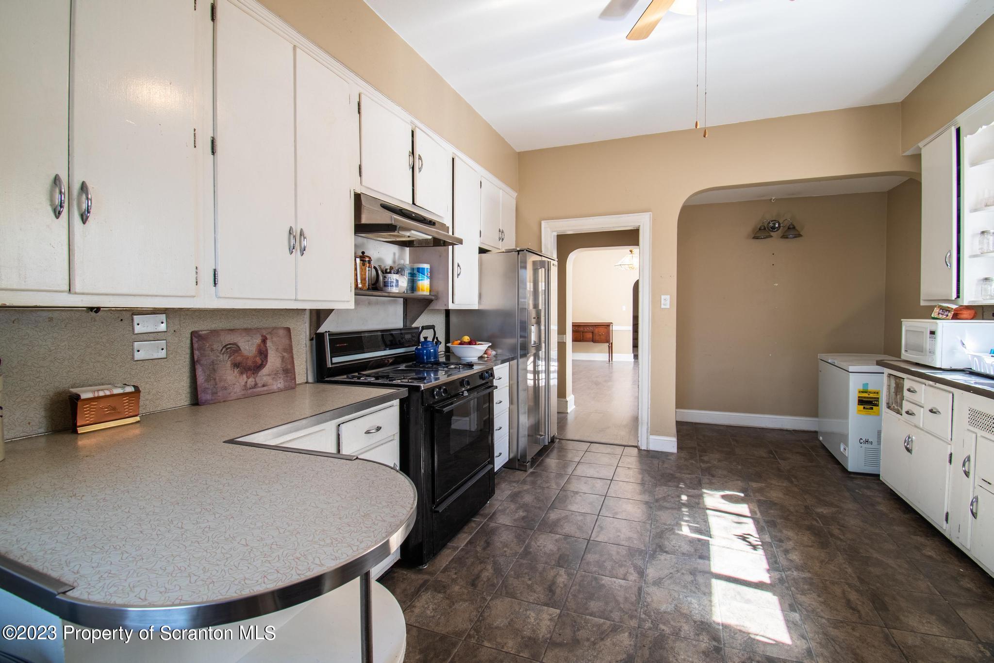 835 North Webster Avenue Scranton, PA 18510 - Photo 35 of 43 a kitchen with stainless steel appliances granite countertop a stove a sink and a refrigerator