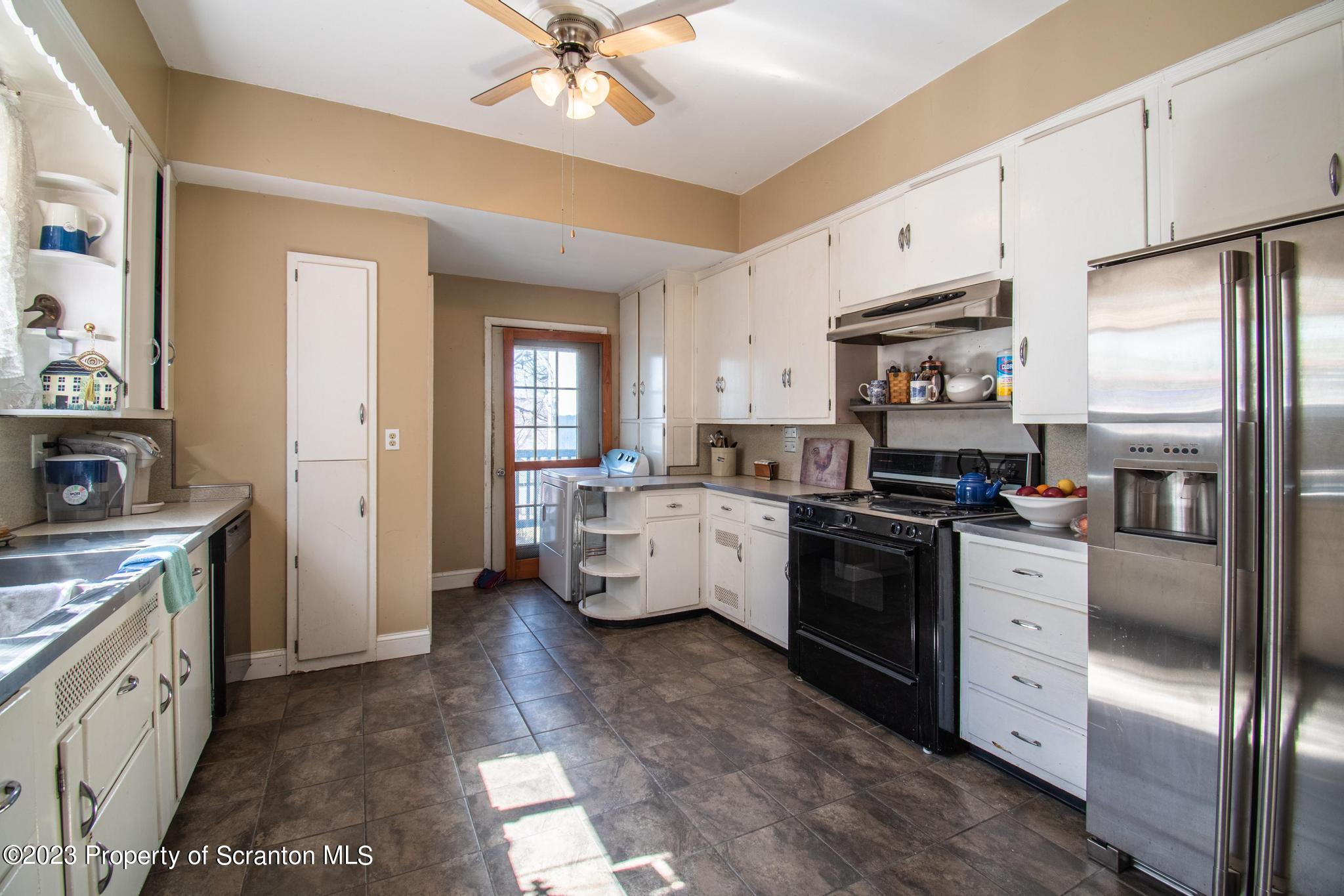 835 North Webster Avenue Scranton, PA 18510 - Photo 36 of 43 a kitchen with white cabinets and stainless steel appliances