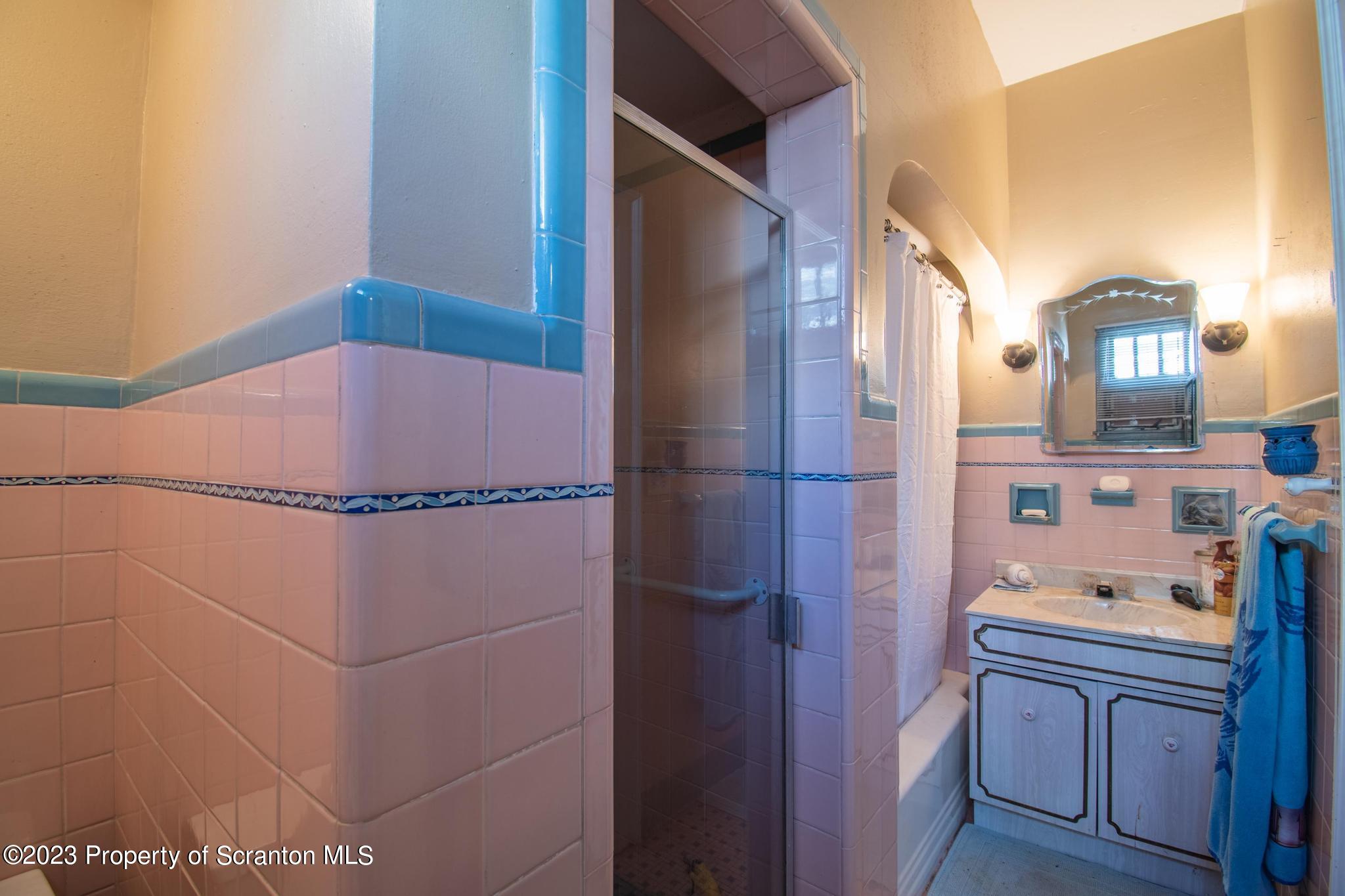 835 North Webster Avenue Scranton, PA 18510 - Photo 37 of 43 a bathroom with a shower and a mirror