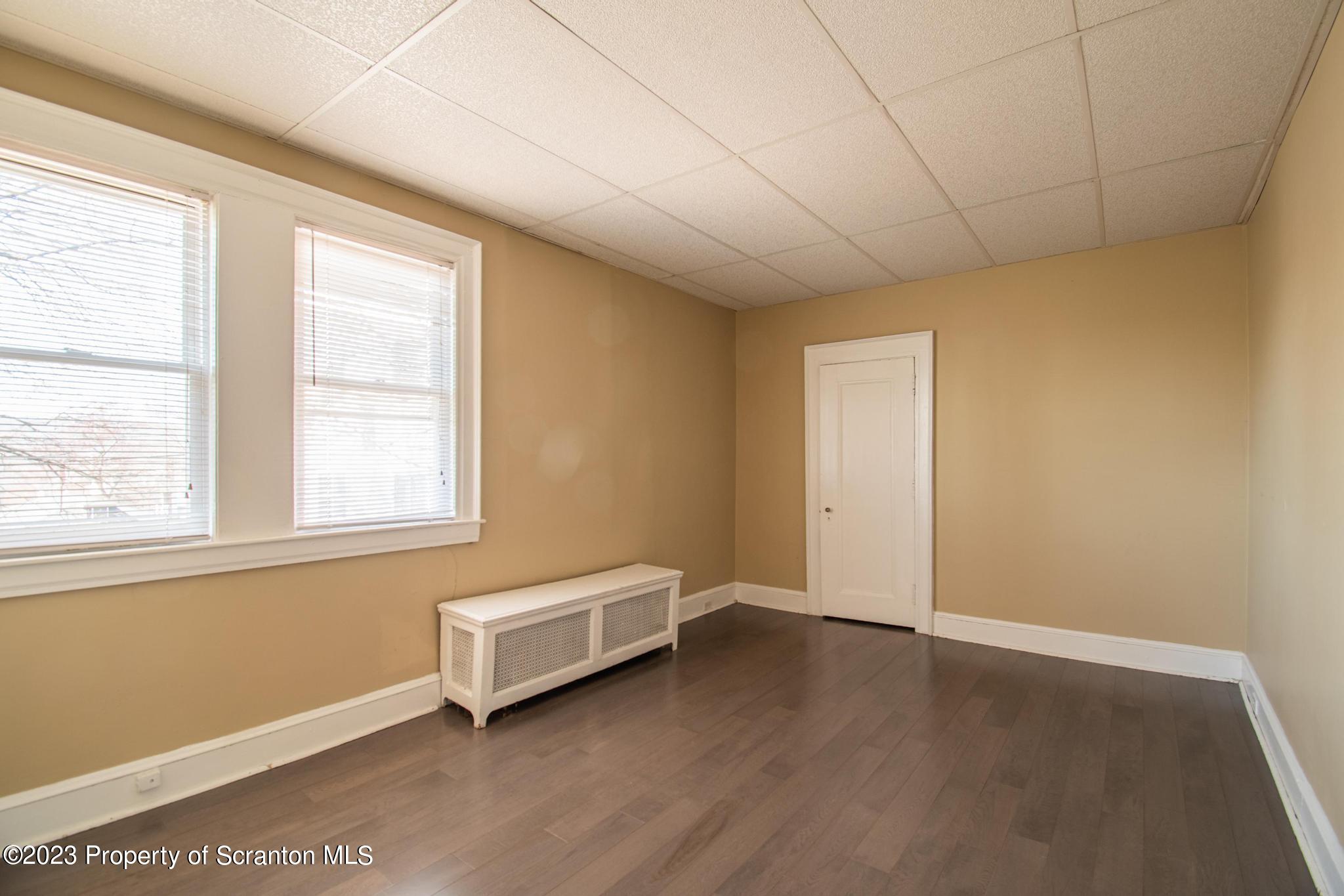 835 North Webster Avenue Scranton, PA 18510 - Photo 39 of 43 a view of a room with wooden floor and window