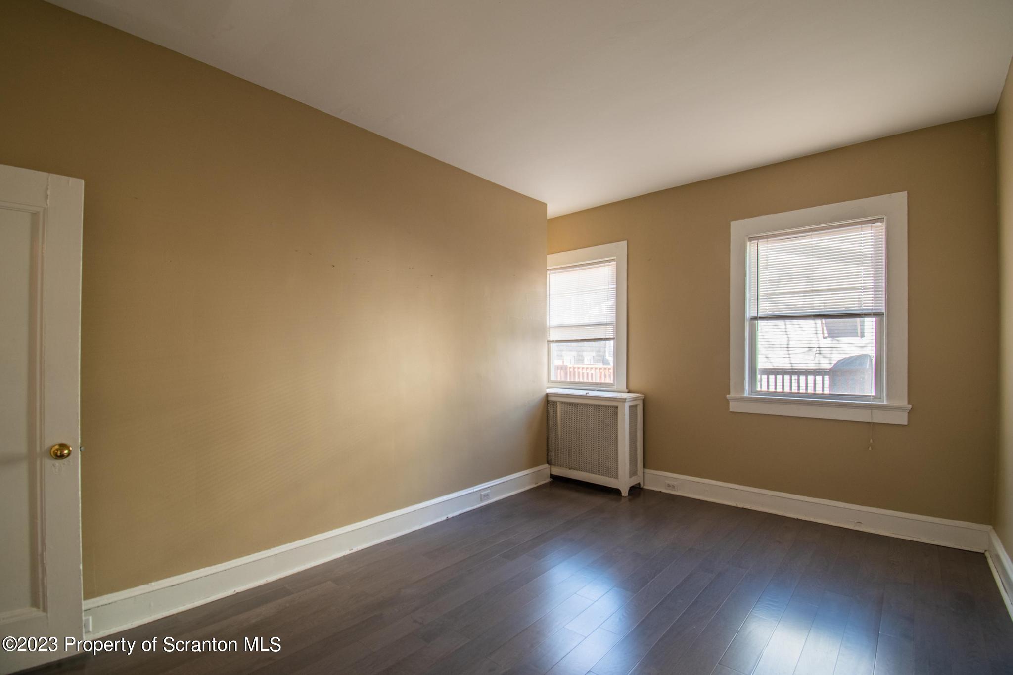 835 North Webster Avenue Scranton, PA 18510 - Photo 41 of 43 an empty room with wooden floor and windows