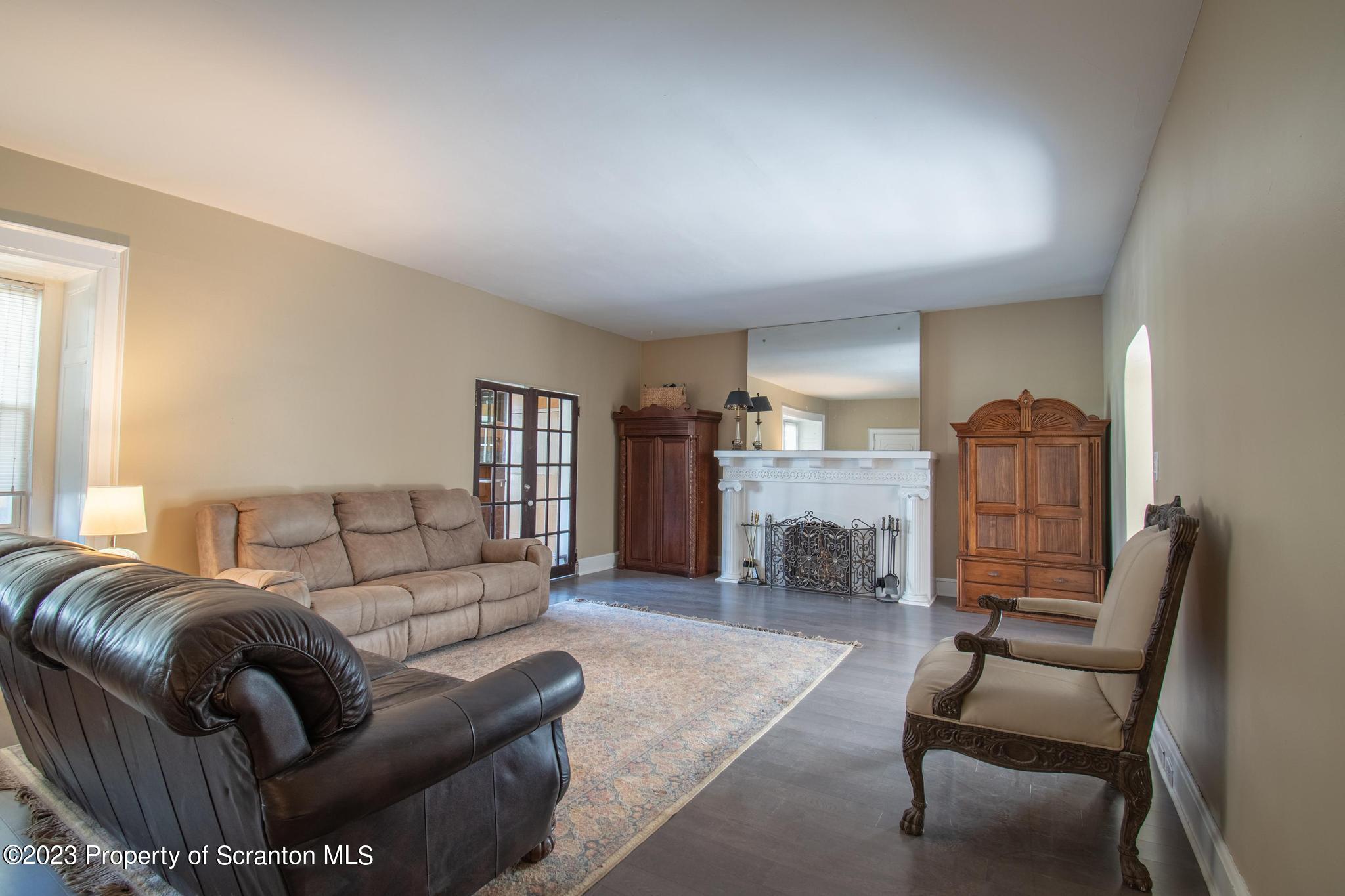 835 North Webster Avenue Scranton, PA 18510 - Photo 42 of 43 a living room with furniture and a fireplace
