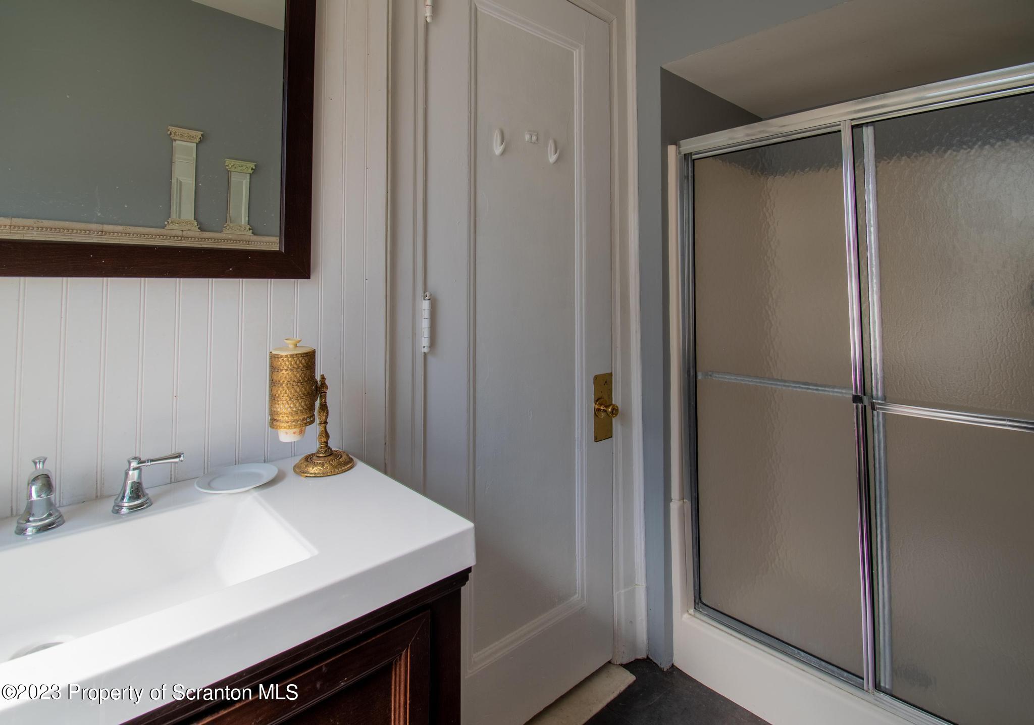 835 North Webster Avenue Scranton, PA 18510 - Photo 10 of 43 a bathroom with a sink and a mirror