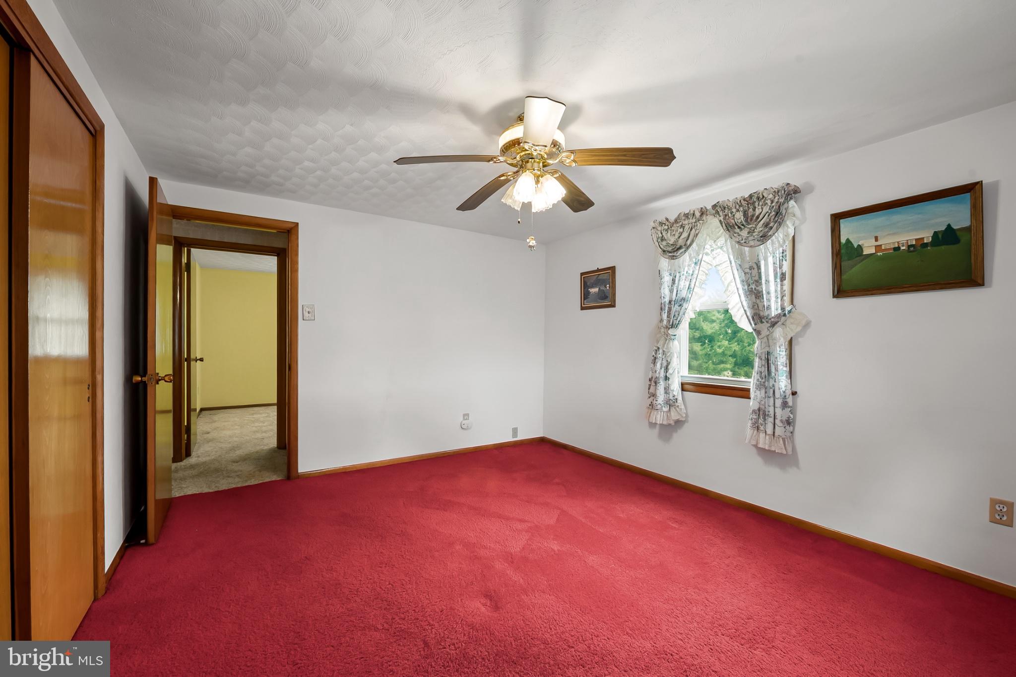 2100 Peterman Road Freeland, MD 21053 - Photo 21 of 36 Cozy room with vibrant red carpet.