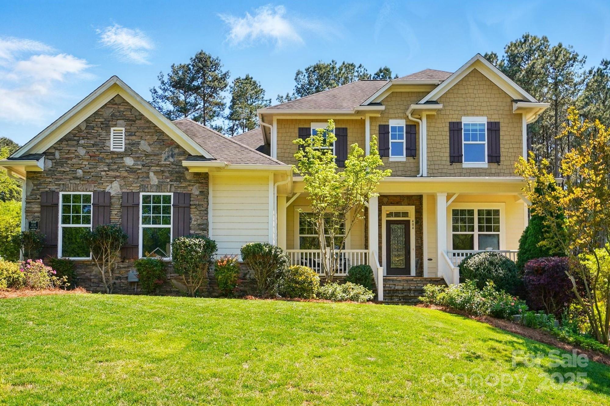 front view of a house with a yard