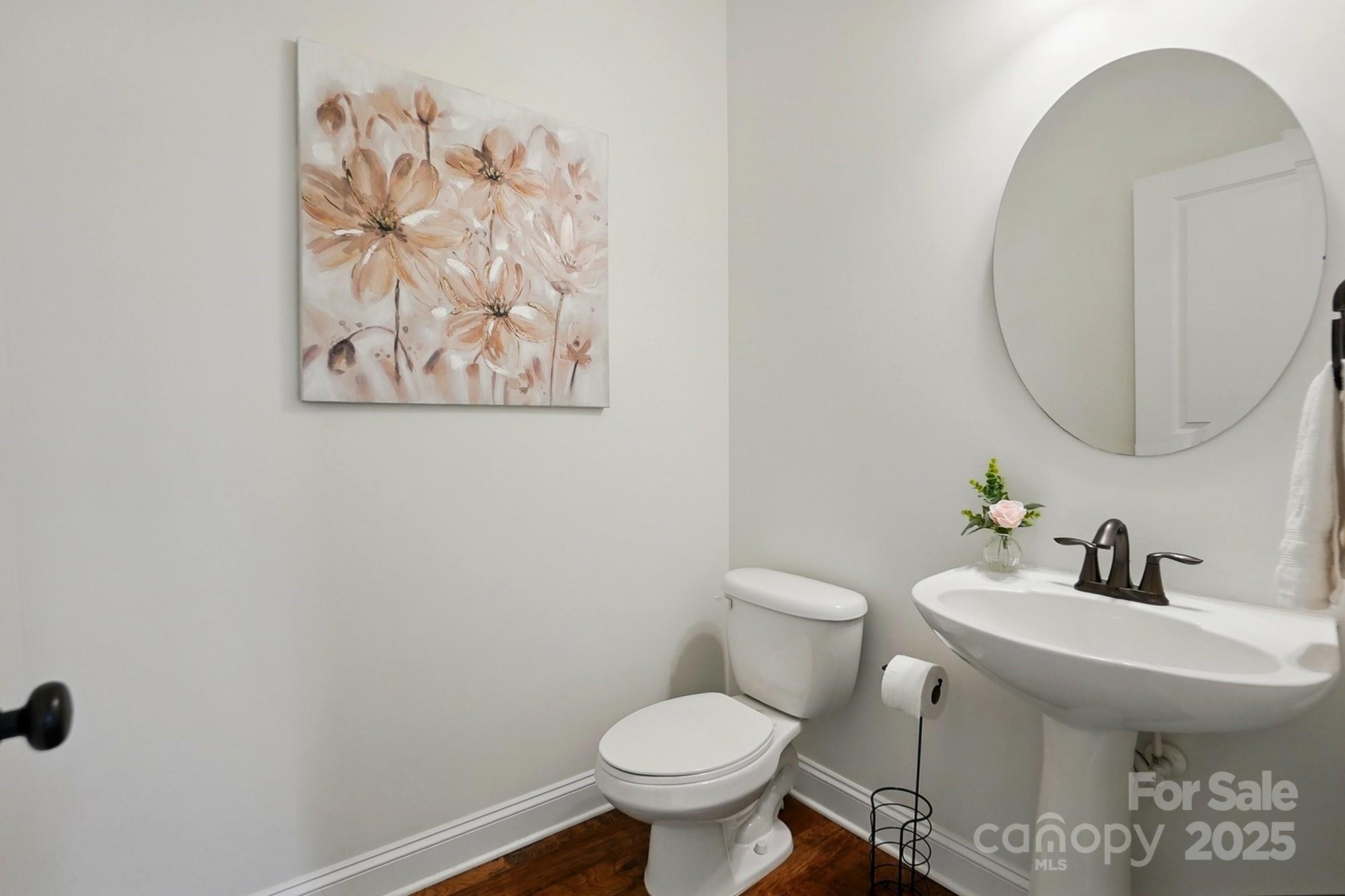 404 Brookridge Drive Mount Holly, NC 28120 - Photo 13 of 44 a bathroom with a toilet and a sink