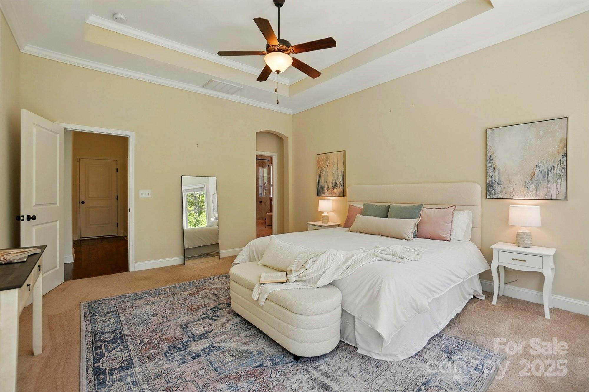 404 Brookridge Drive Mount Holly, NC 28120 - Photo 16 of 44 a bedroom with a bed and a chandelier