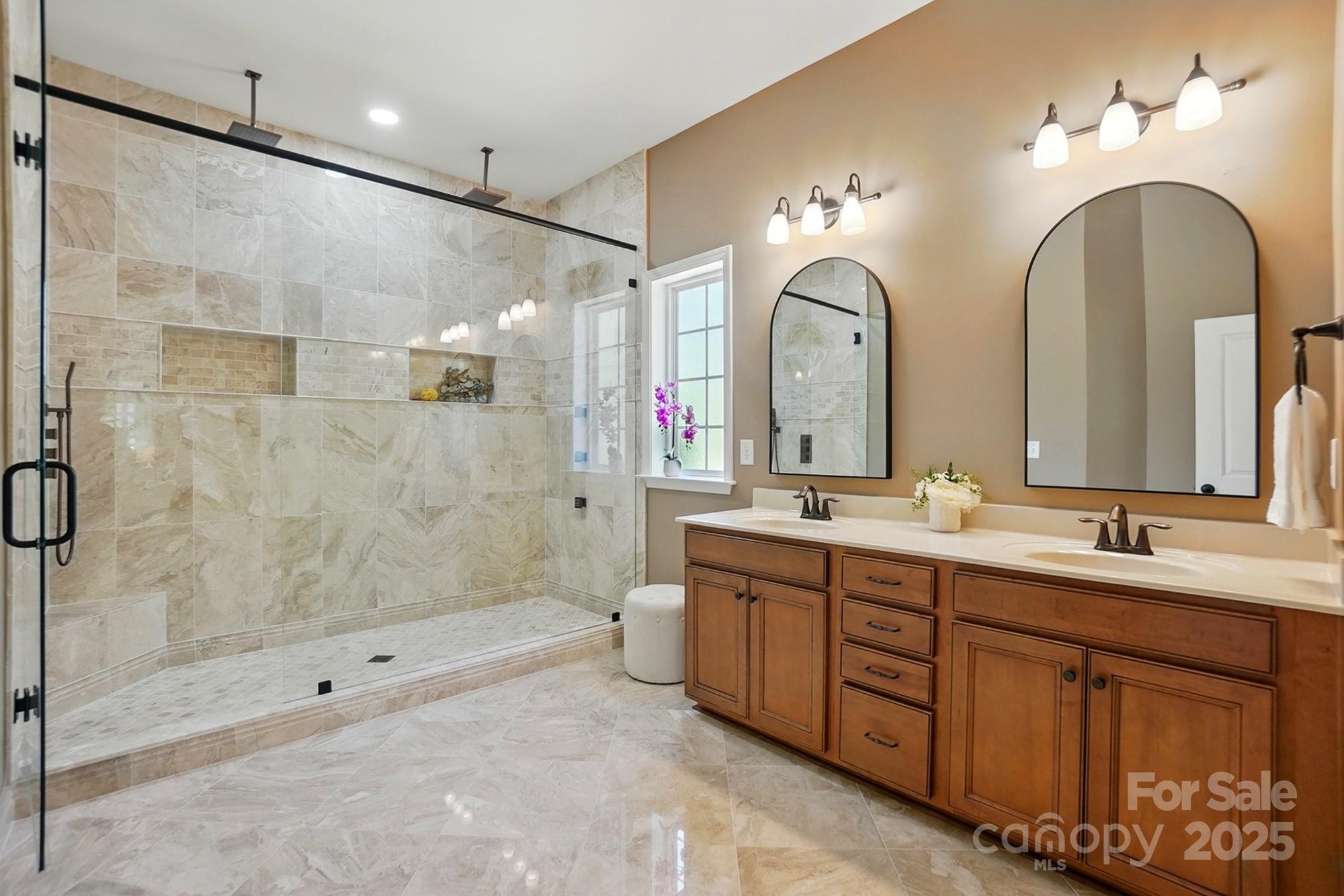 404 Brookridge Drive Mount Holly, NC 28120 - Photo 17 of 44 a bathroom with double sink and a mirror