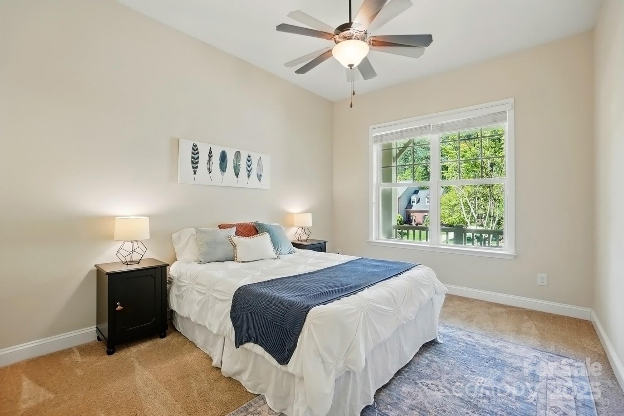 404 Brookridge Drive Mount Holly, NC 28120 - Photo 20 of 44 a bedroom with a large bed and a window