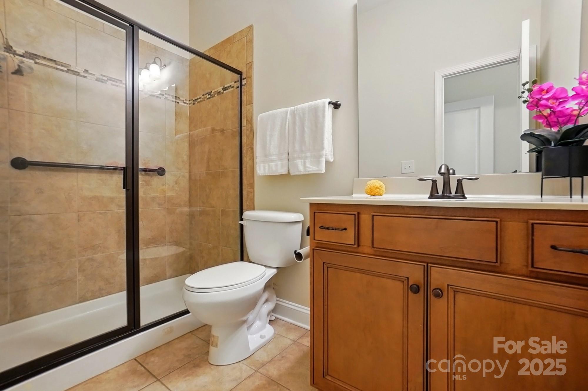 404 Brookridge Drive Mount Holly, NC 28120 - Photo 21 of 44 a bathroom with a sink toilet and shower