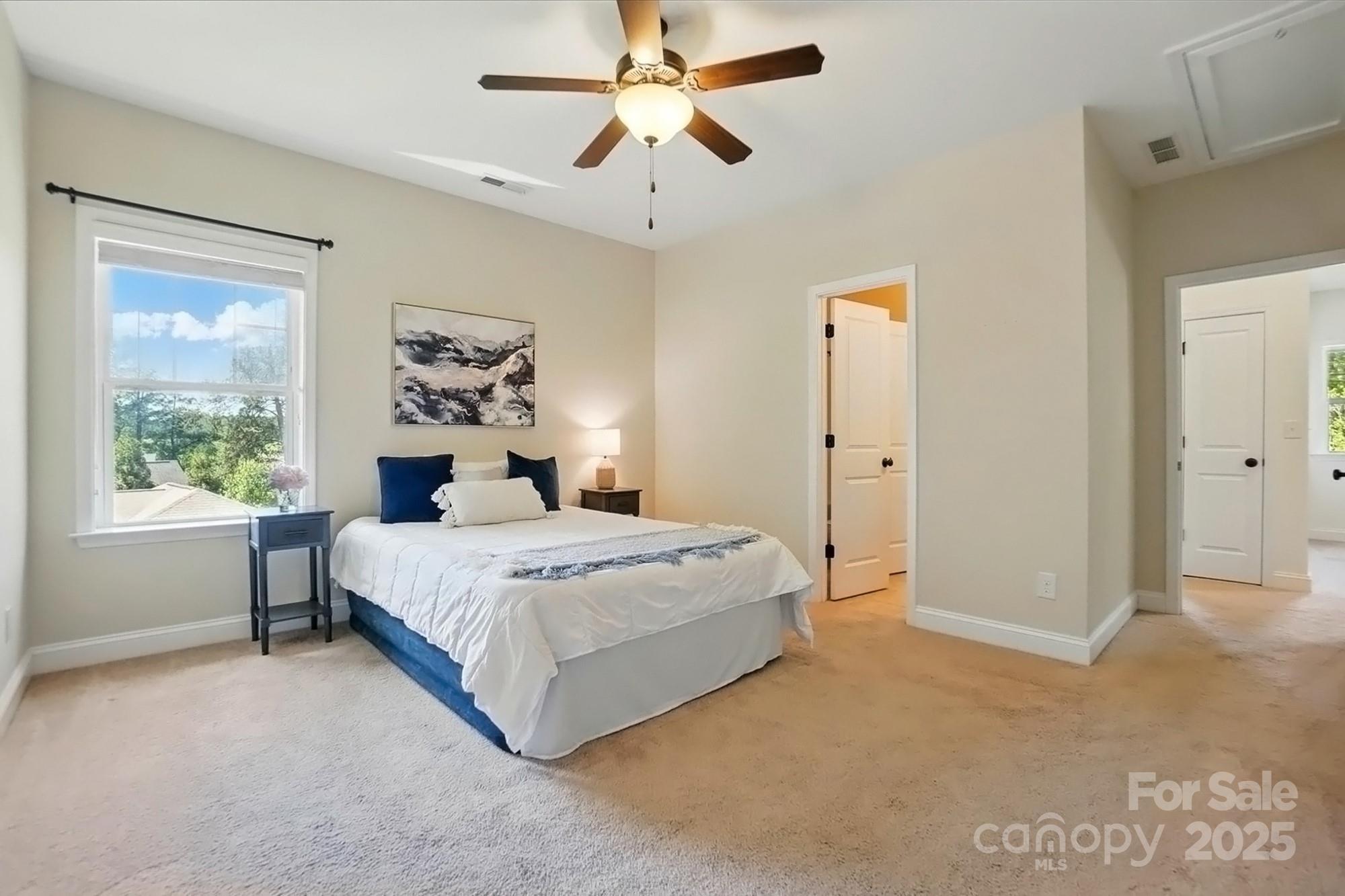 404 Brookridge Drive Mount Holly, NC 28120 - Photo 23 of 44 a spacious bedroom with a bed and a window