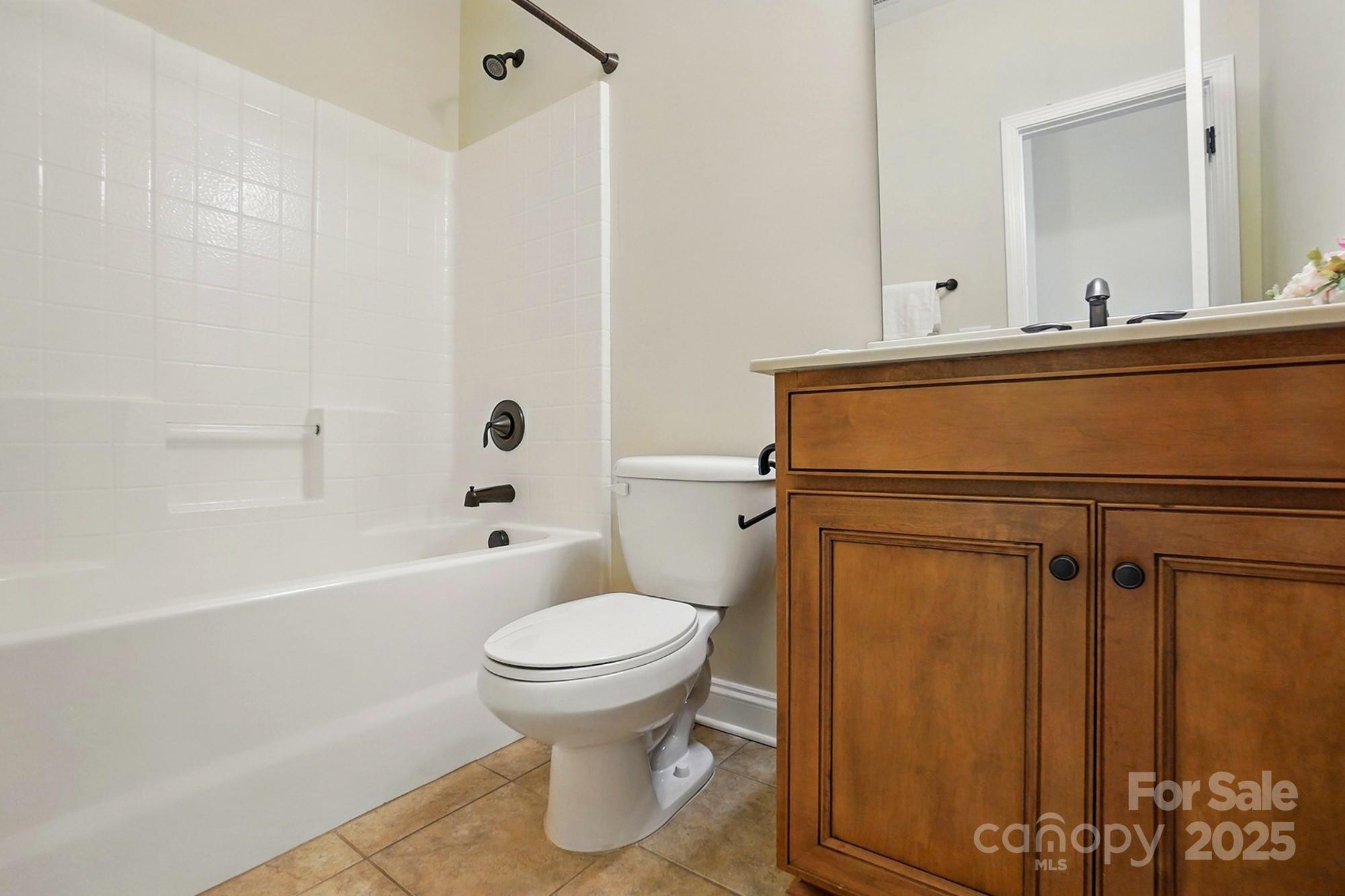 404 Brookridge Drive Mount Holly, NC 28120 - Photo 27 of 44 a bathroom with a sink toilet and shower