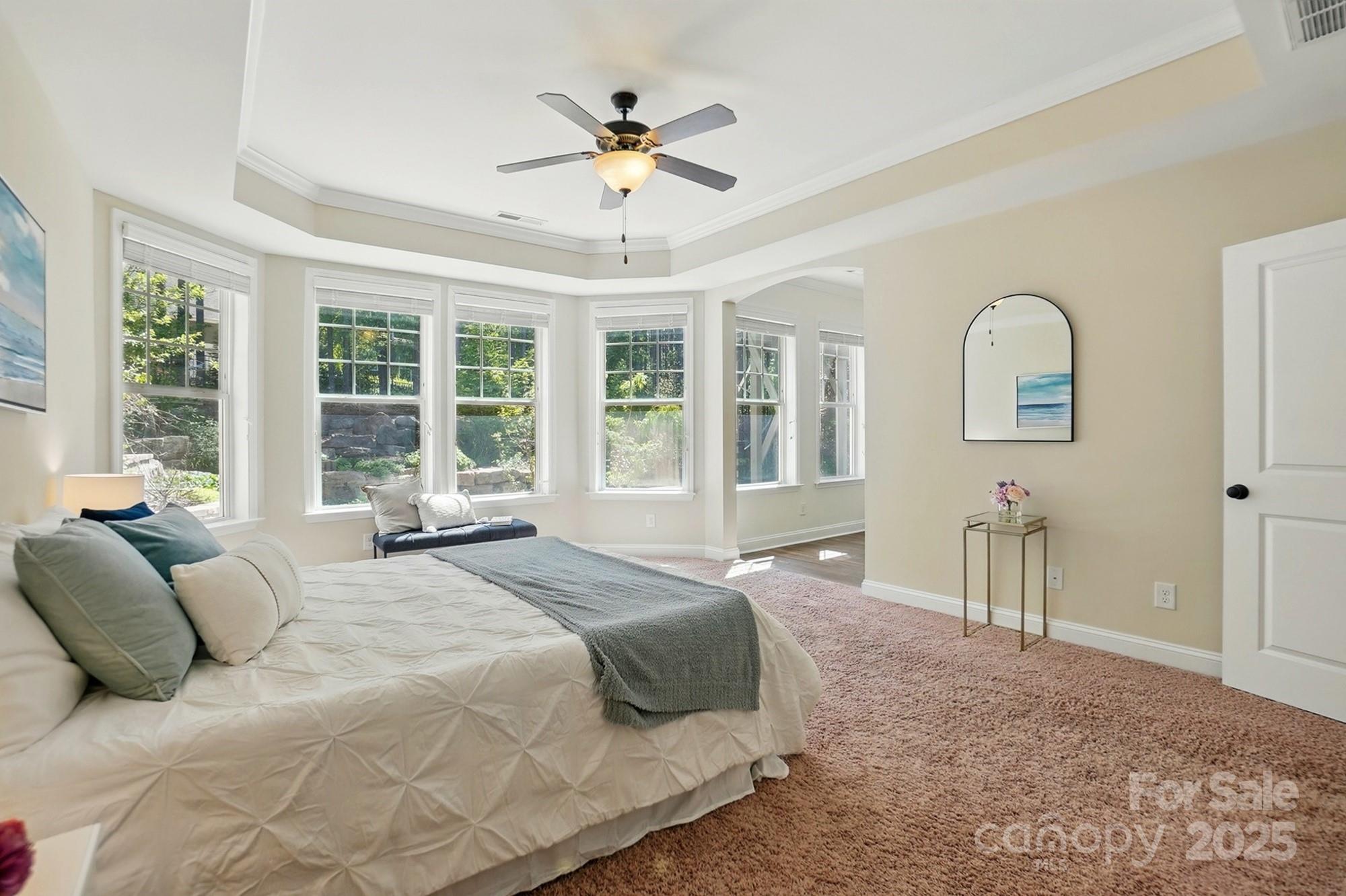 404 Brookridge Drive Mount Holly, NC 28120 - Photo 30 of 44 a spacious bedroom with a large bed and windows