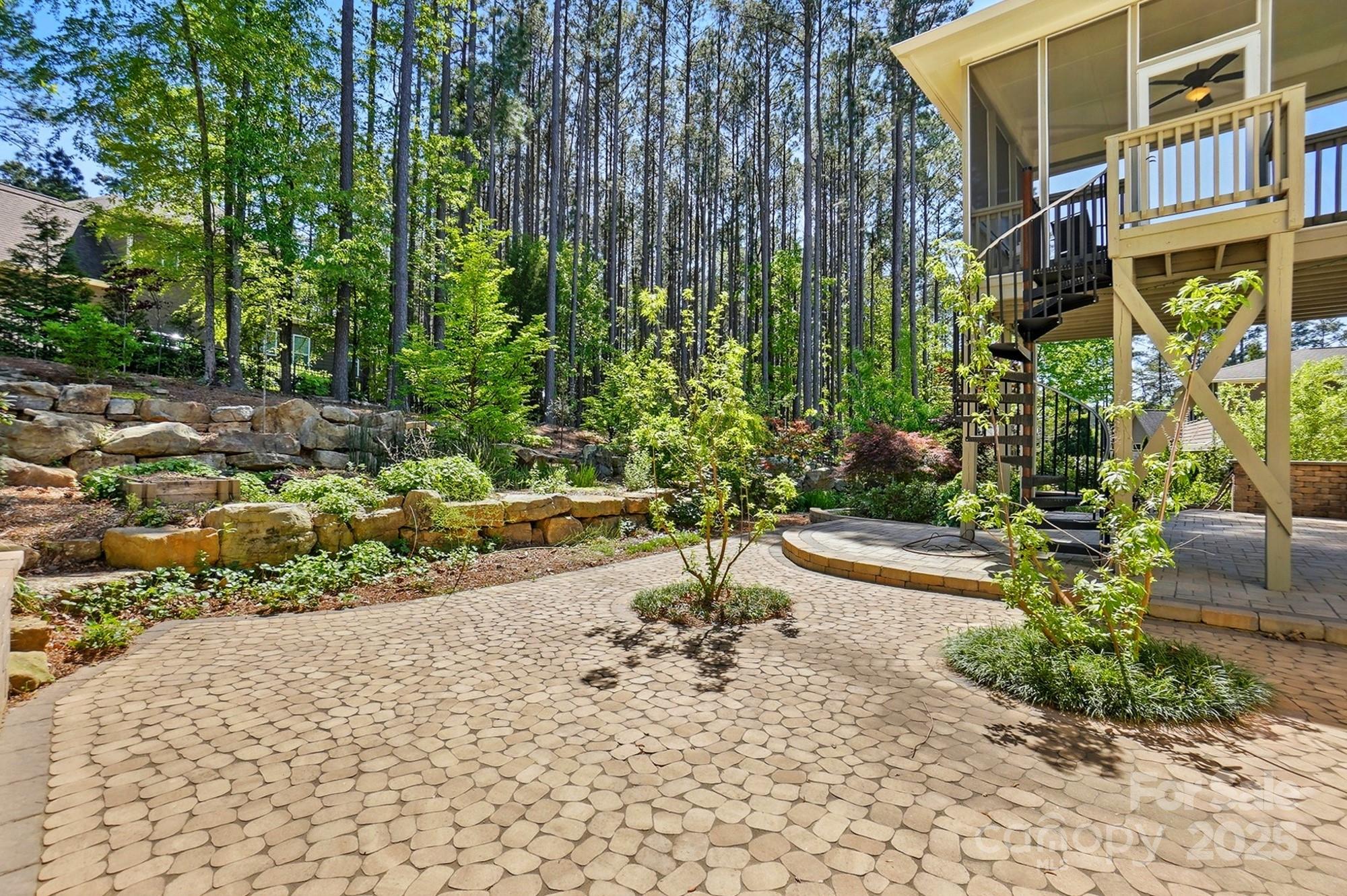 404 Brookridge Drive Mount Holly, NC 28120 - Photo 37 of 44 a view of a pathway with a house