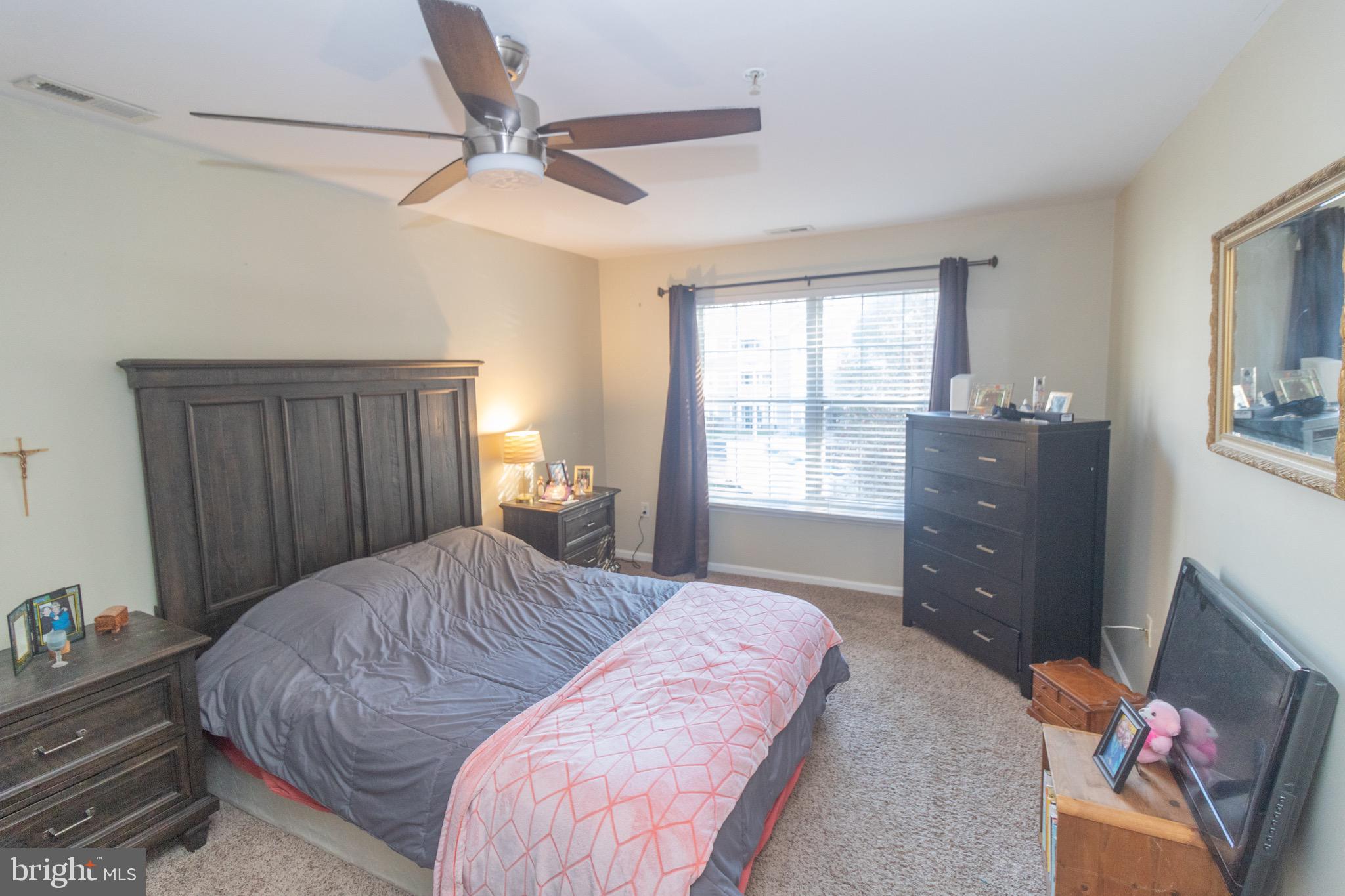 219 Lawrence Lane Riverside, NJ 08075 - Photo 11 of 23 a bedroom with a bed and a dresser