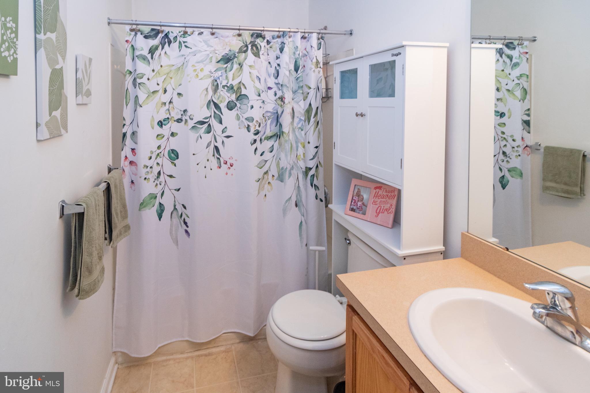 219 Lawrence Lane Riverside, NJ 08075 - Photo 19 of 23 a bathroom with a sink toilet and shower