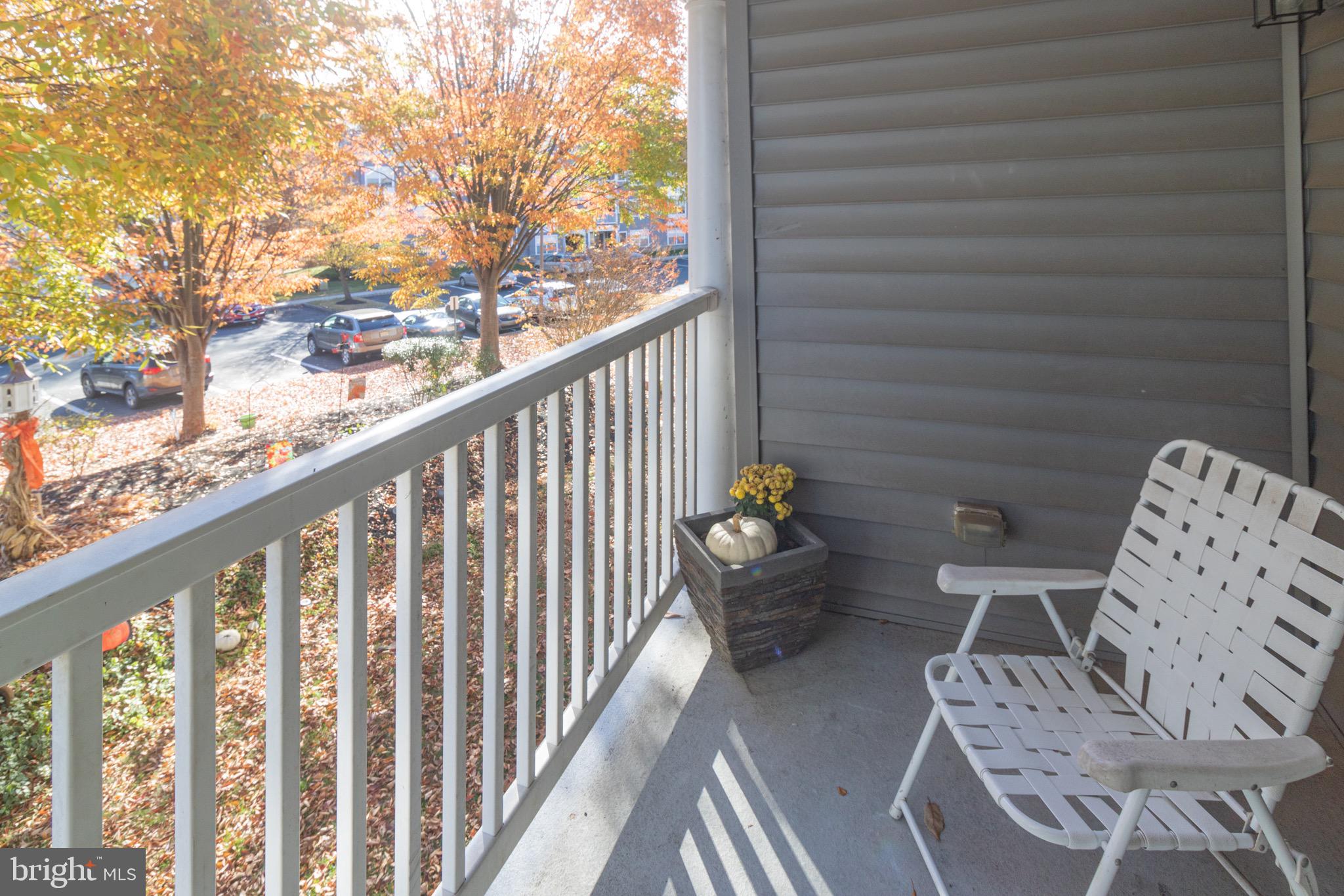 219 Lawrence Lane Riverside, NJ 08075 - Photo 20 of 23 a balcony with table and chairs