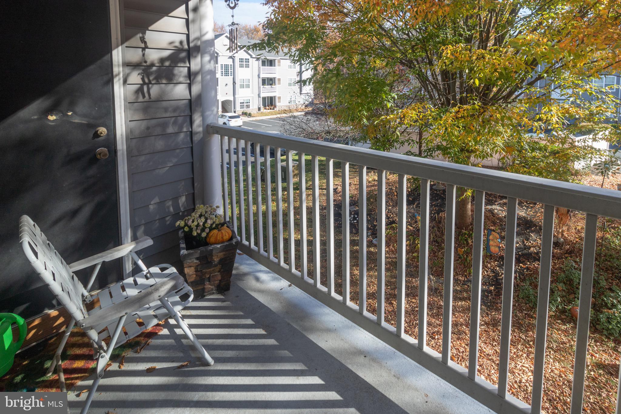 219 Lawrence Lane Riverside, NJ 08075 - Photo 21 of 23 a view of a balcony with chairs and wooden fence