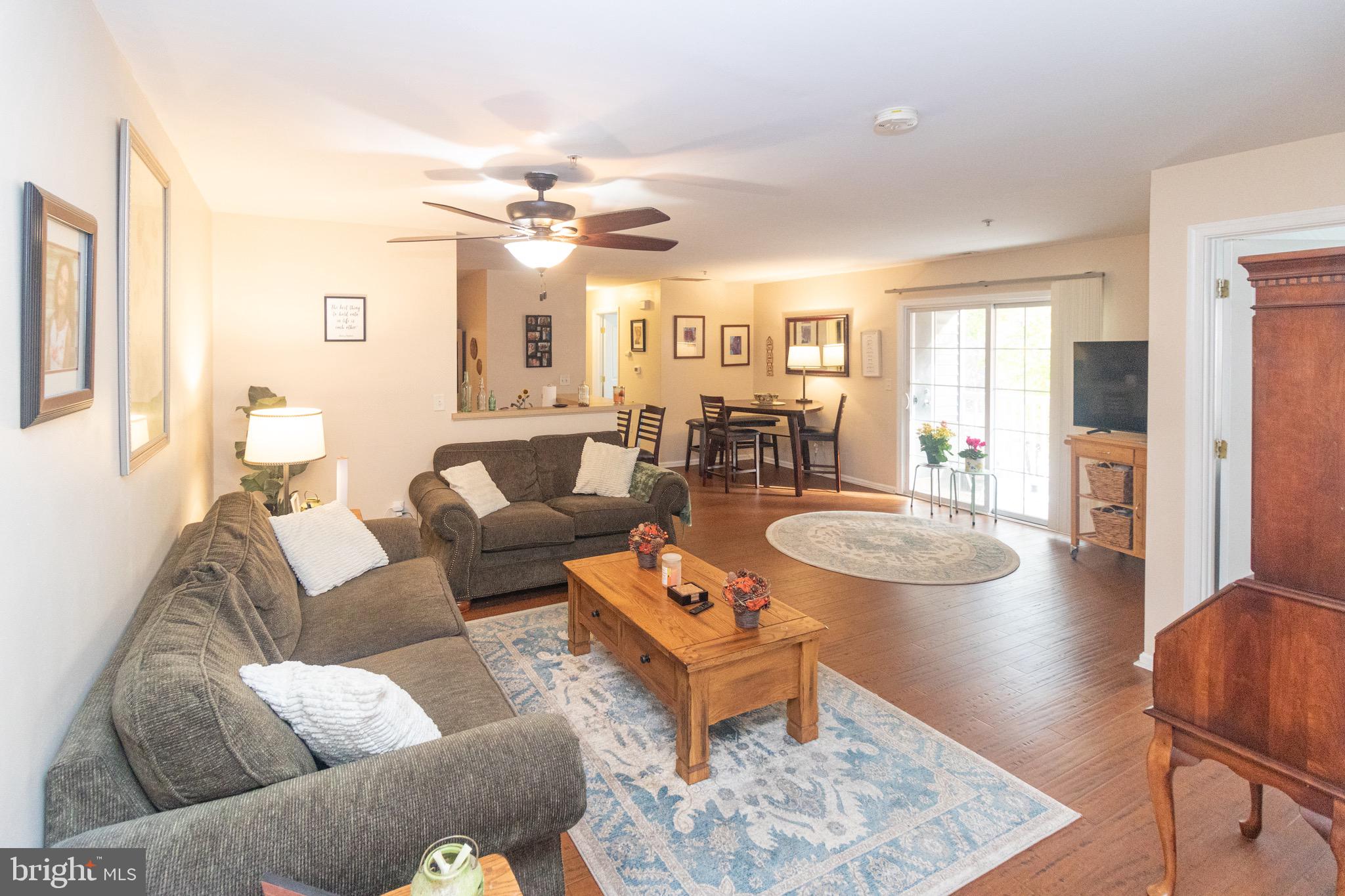 219 Lawrence Lane Riverside, NJ 08075 - Photo 3 of 23 a living room with furniture and wooden floor