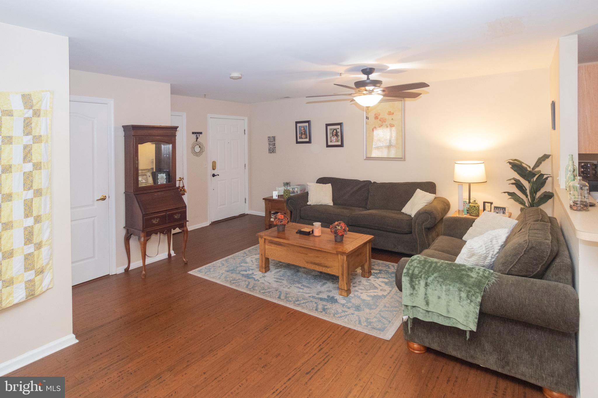 219 Lawrence Lane Riverside, NJ 08075 - Photo 4 of 23 a living room with furniture and a wooden floor