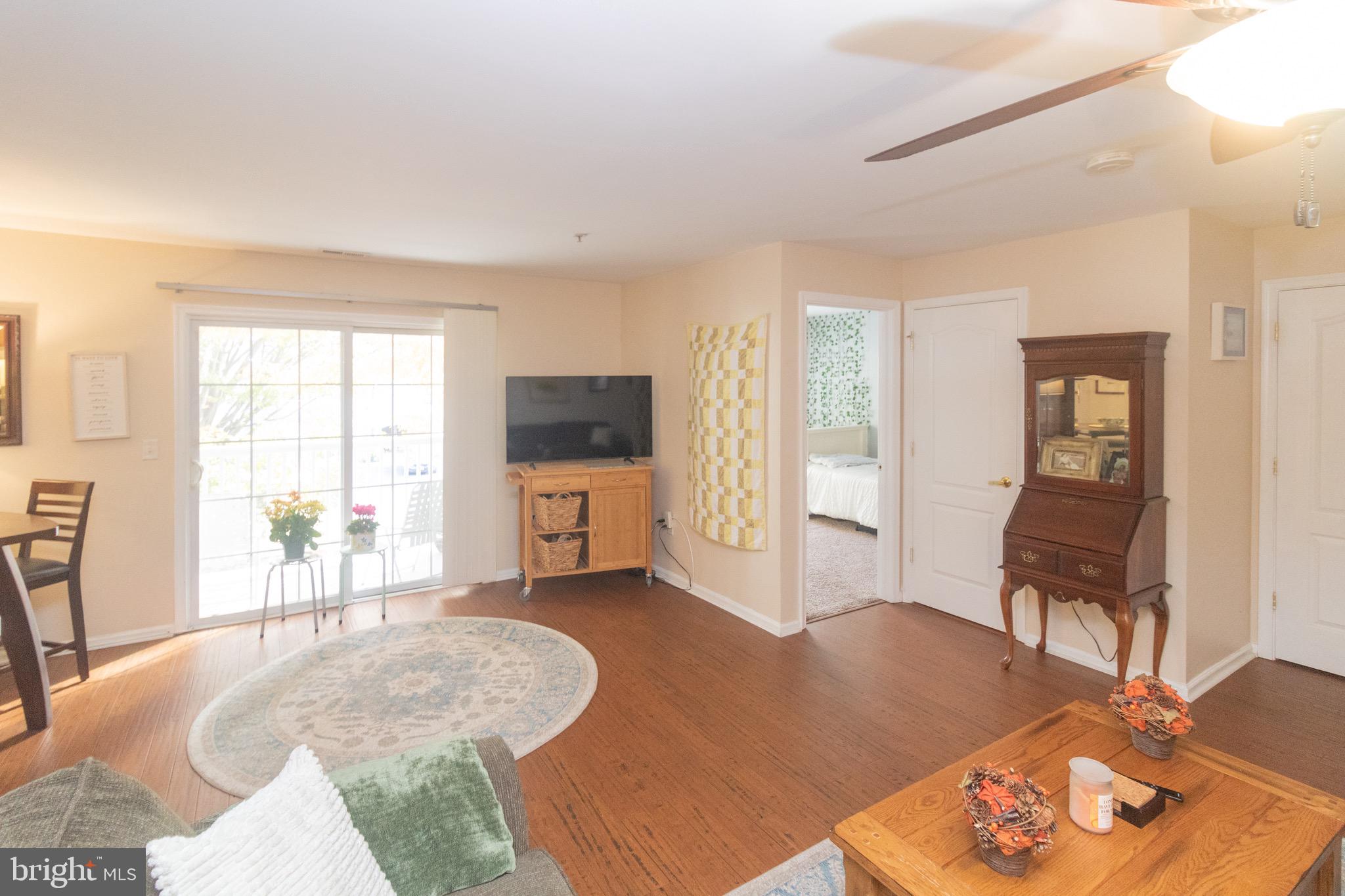219 Lawrence Lane Riverside, NJ 08075 - Photo 5 of 23 a living room with furniture a flat screen tv and a large window