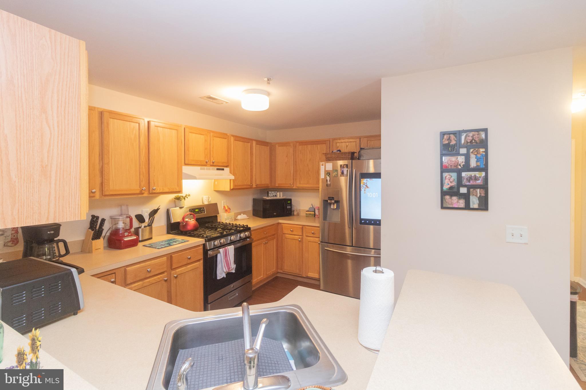 219 Lawrence Lane Riverside, NJ 08075 - Photo 8 of 23 a kitchen with a sink and cabinets