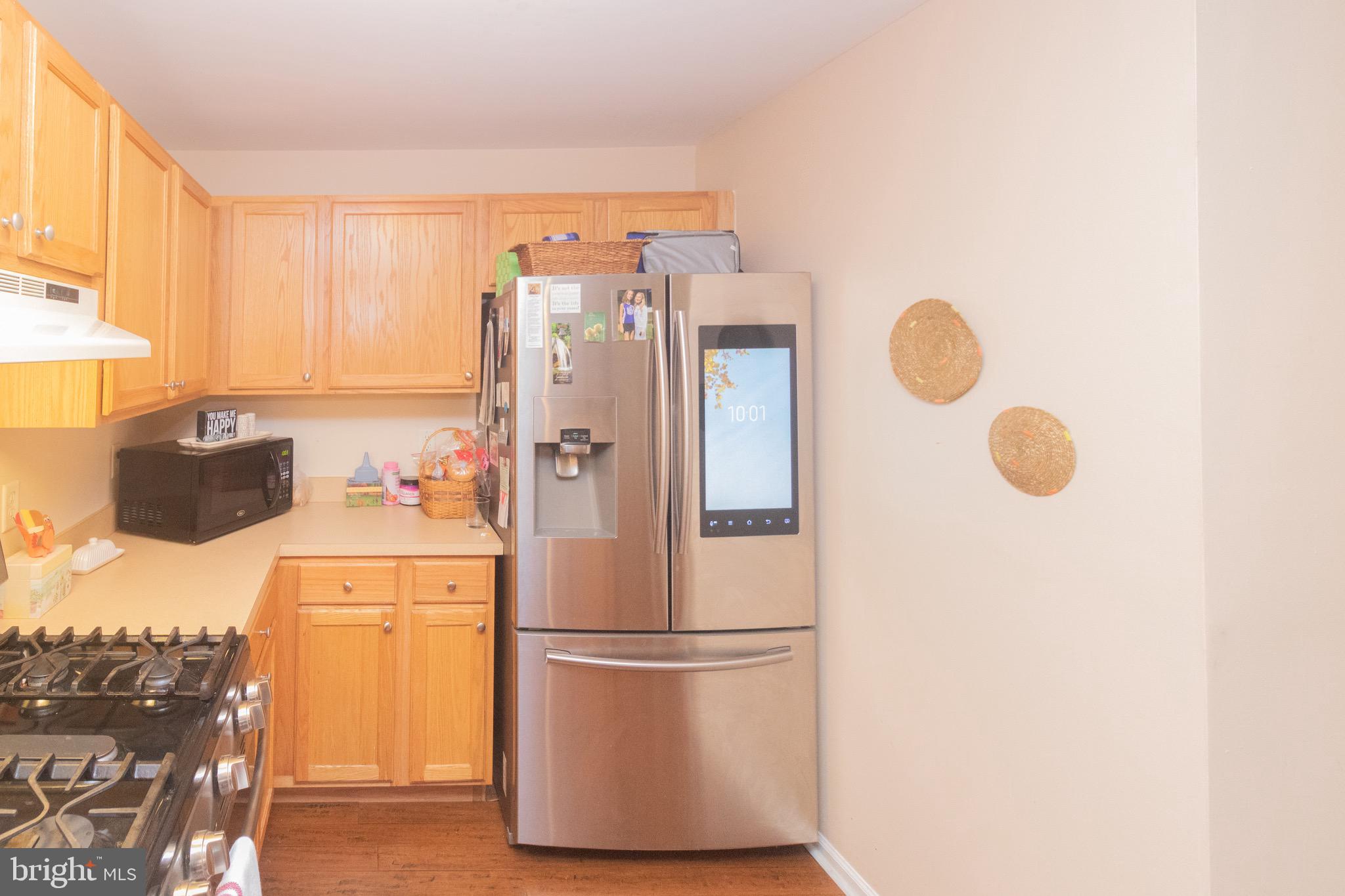 219 Lawrence Lane Riverside, NJ 08075 - Photo 10 of 23 a white refrigerator freezer sitting in a kitchen